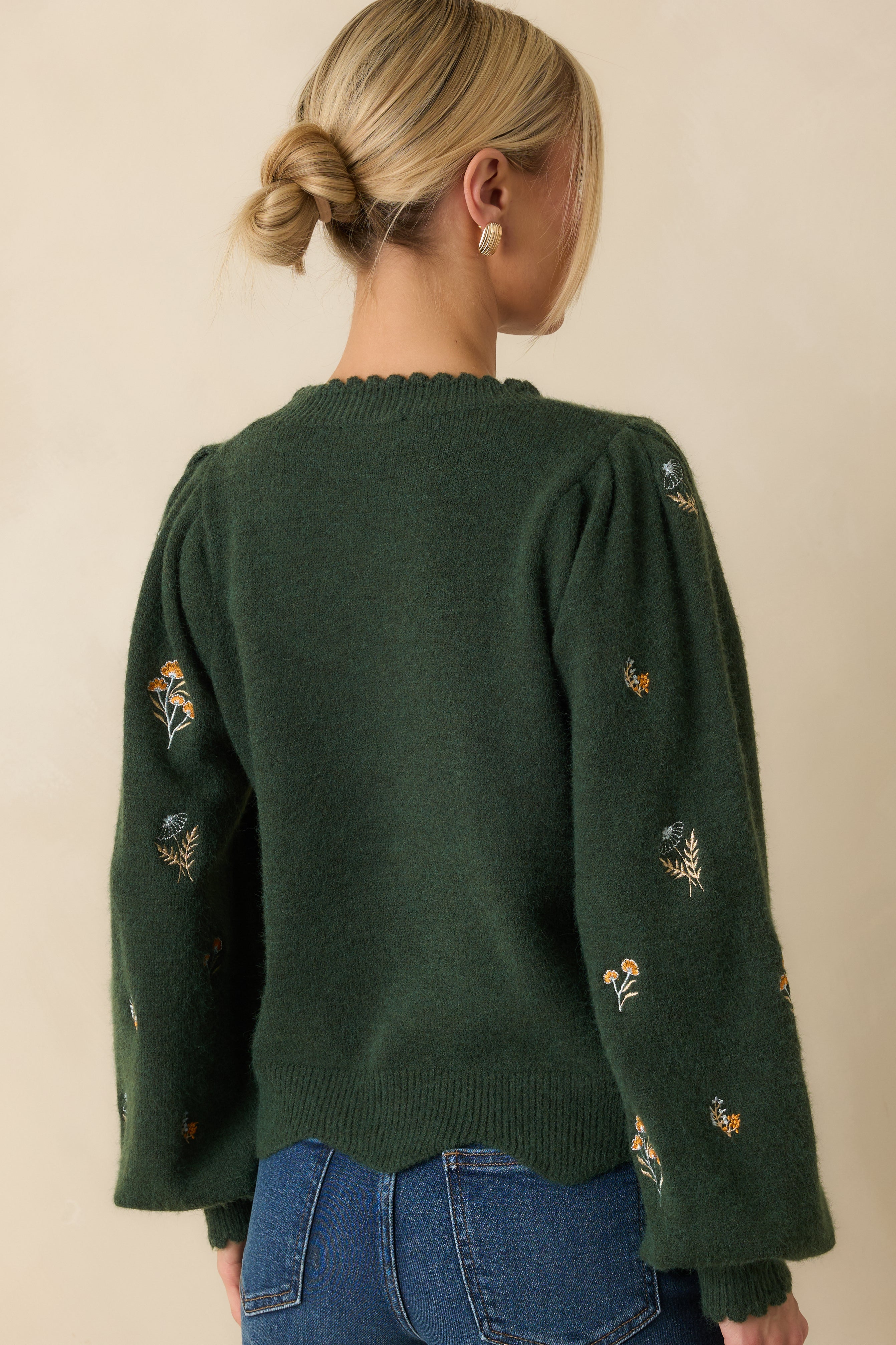 Rear view of the hunter green knit sweater showing the relaxed silhouette and subtle textured finish.