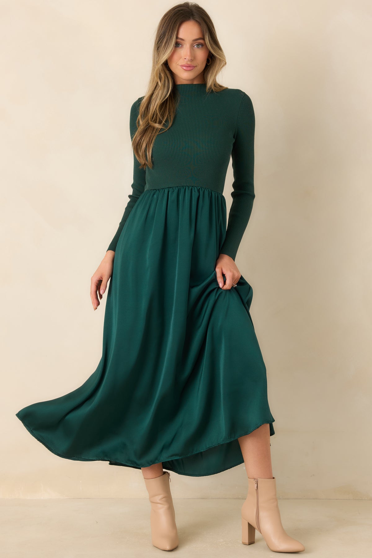 Elegant hunter green fit-and-flare dress with a ribbed mock-neck top and a softly lustrous skirt.