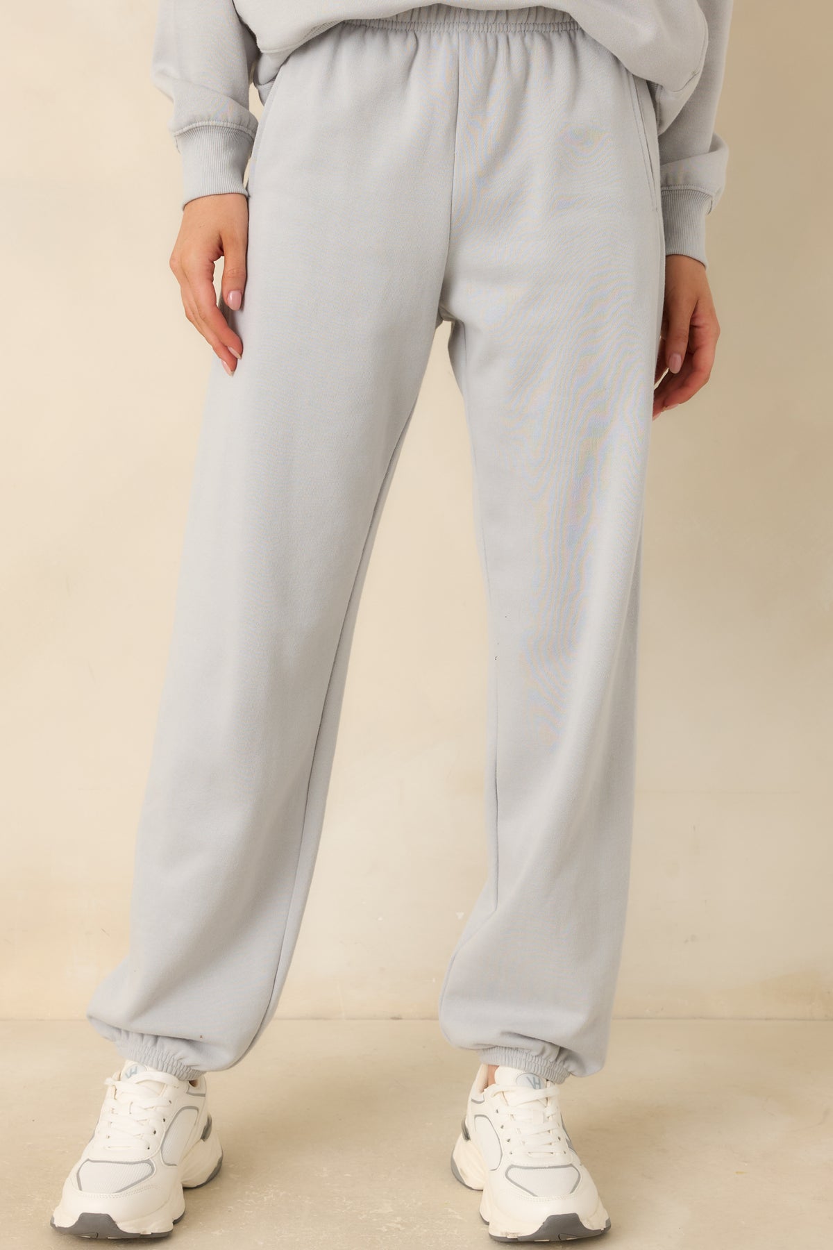 Icy grey fleece joggers with gathered ankle cuffs and a softly tapered finish.