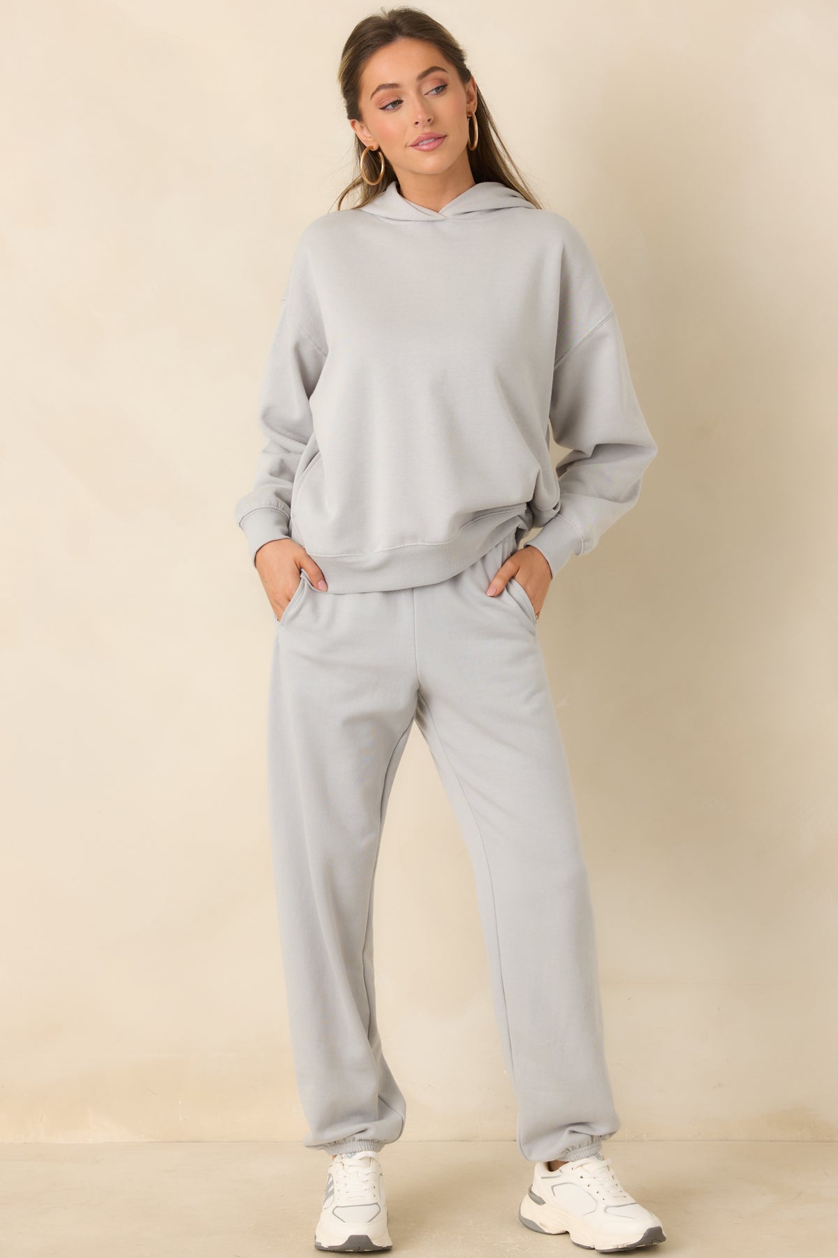 Icy grey pull-on joggers with roomy legs, a comfortable waistband, and functional side pockets.