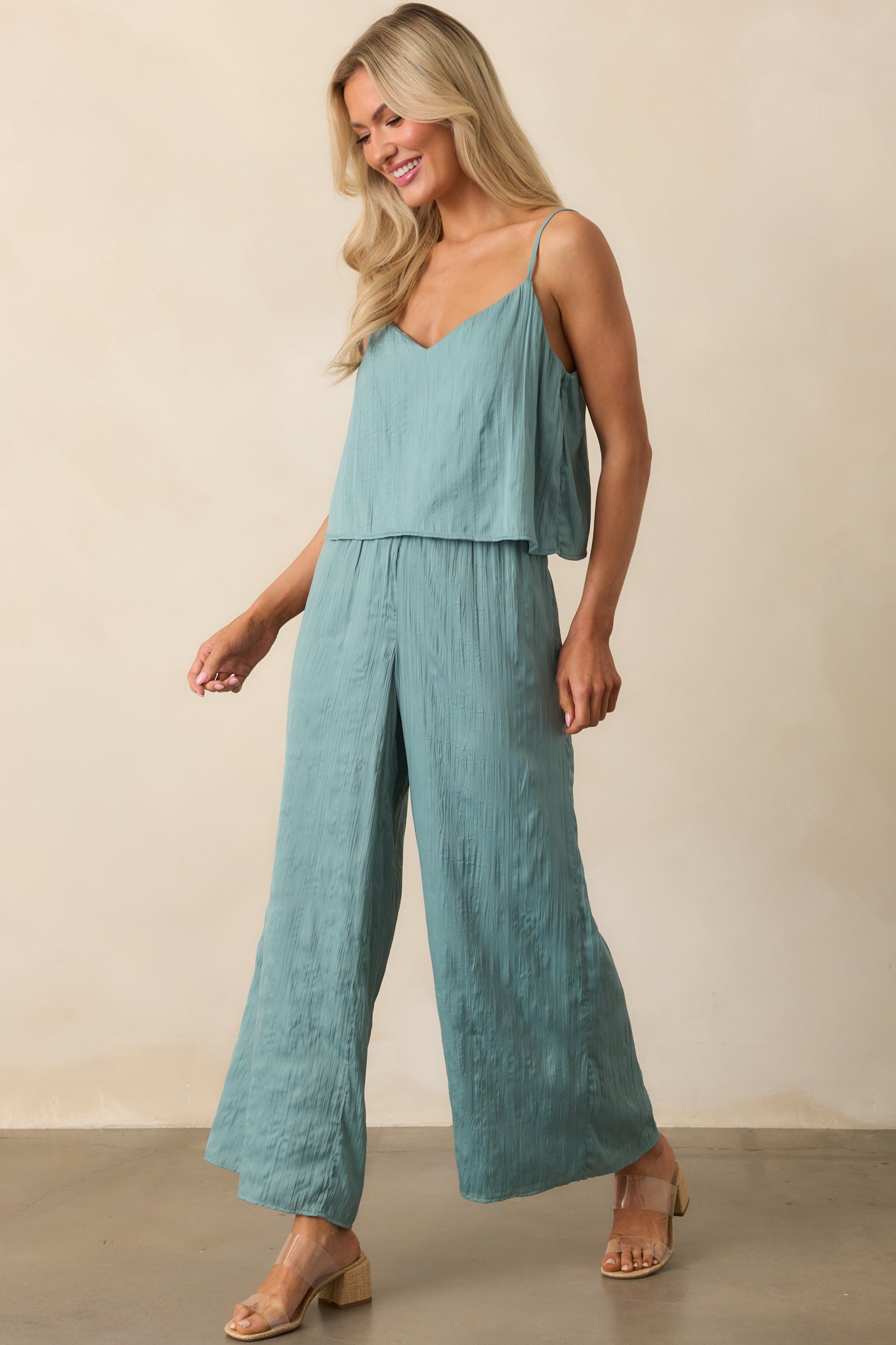 Complete outfit image displaying the lined interior and casual silhouette of the sage green v-neck top.