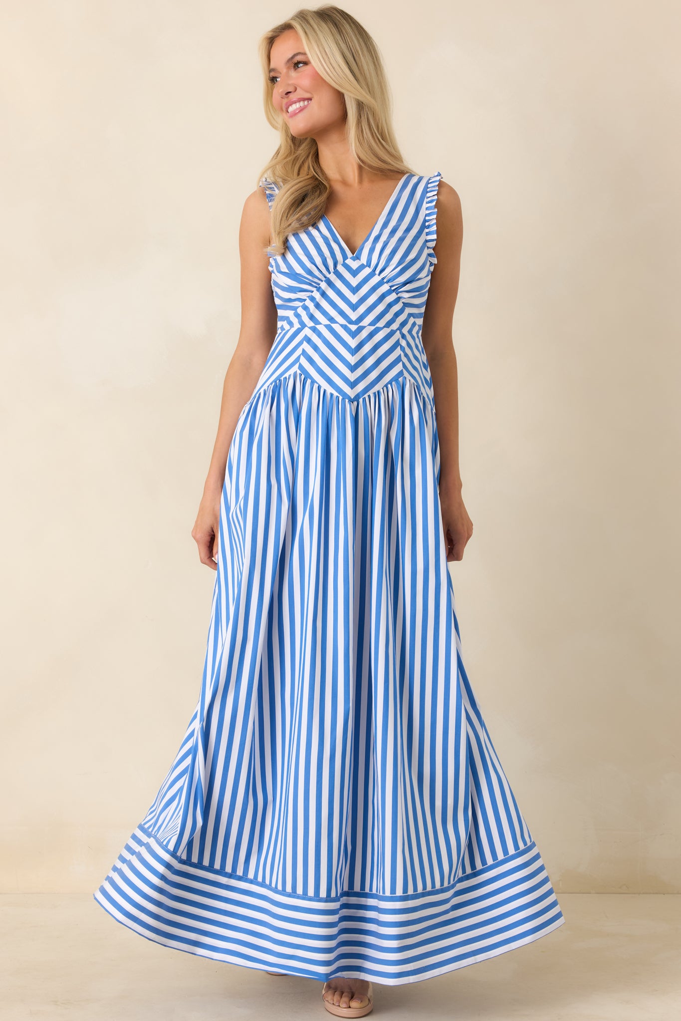 Front-facing image emphasizing the gathered skirt and full-length silhouette.
