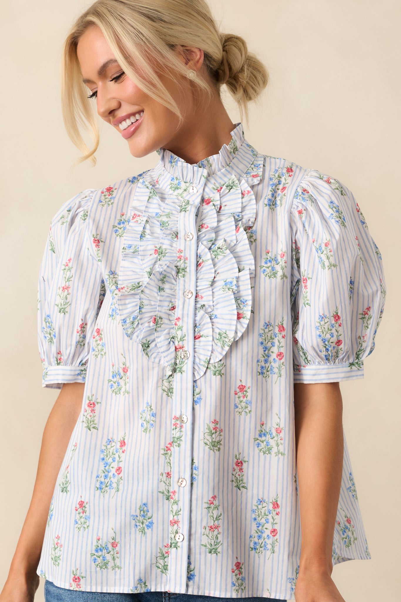 Focused image of the short puff sleeve and shoulder area, highlighting the soft structure and ruffle edge.