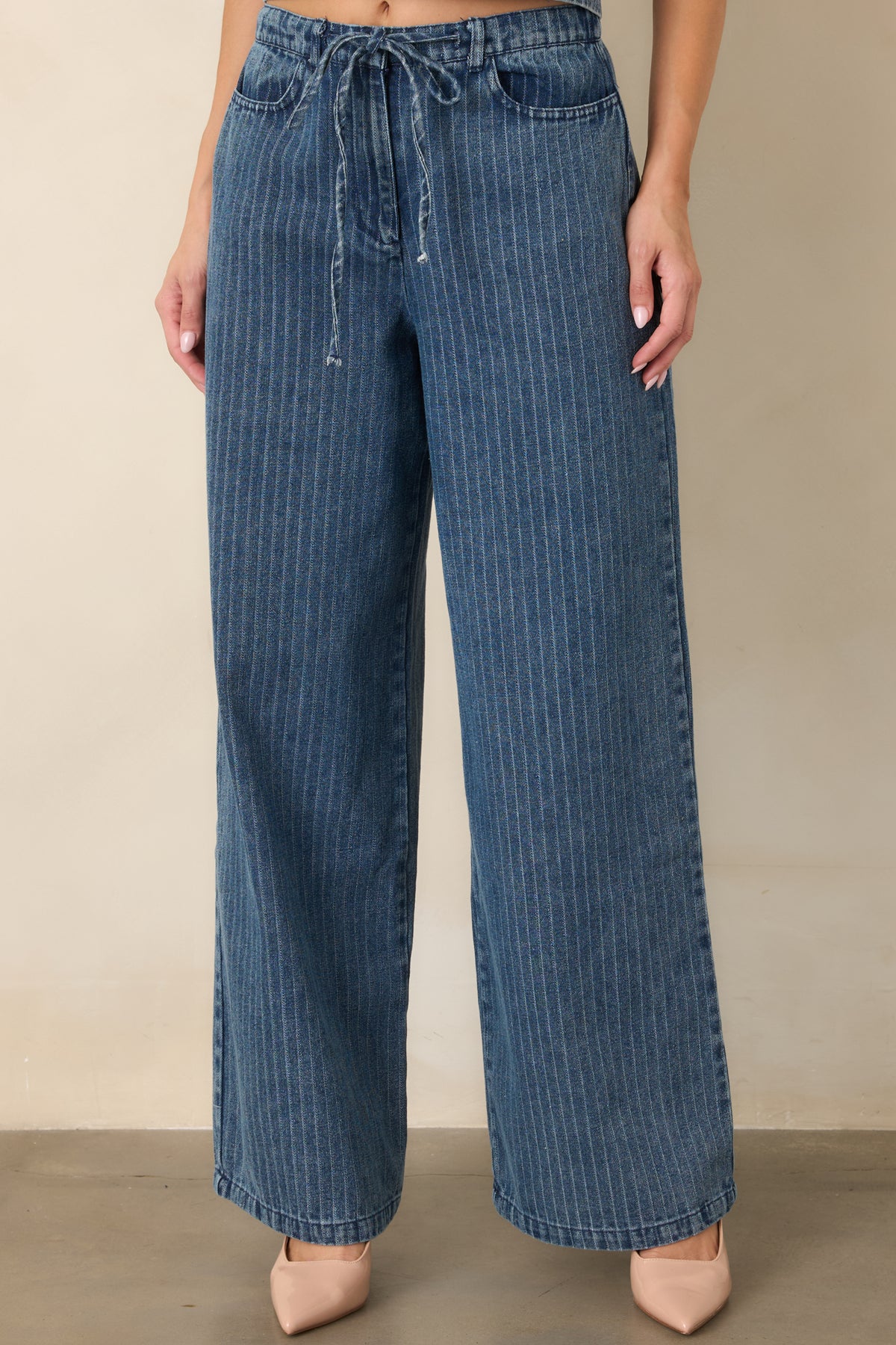 Detailed view of the pants showcasing the soft cotton-blend denim fabric, wide-leg construction, and functional side pocket.