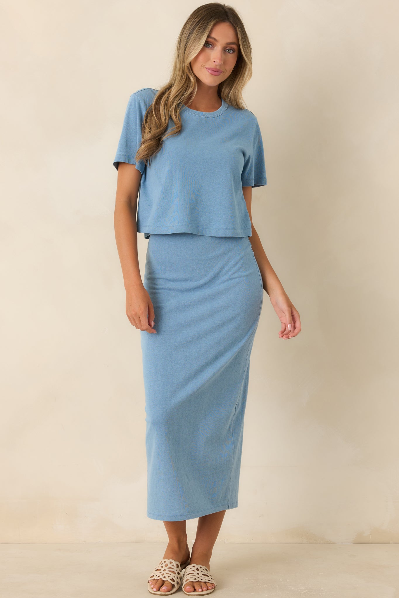 Indigo knit top designed with a relaxed drape, classic crew neck, and comfortable short sleeves.