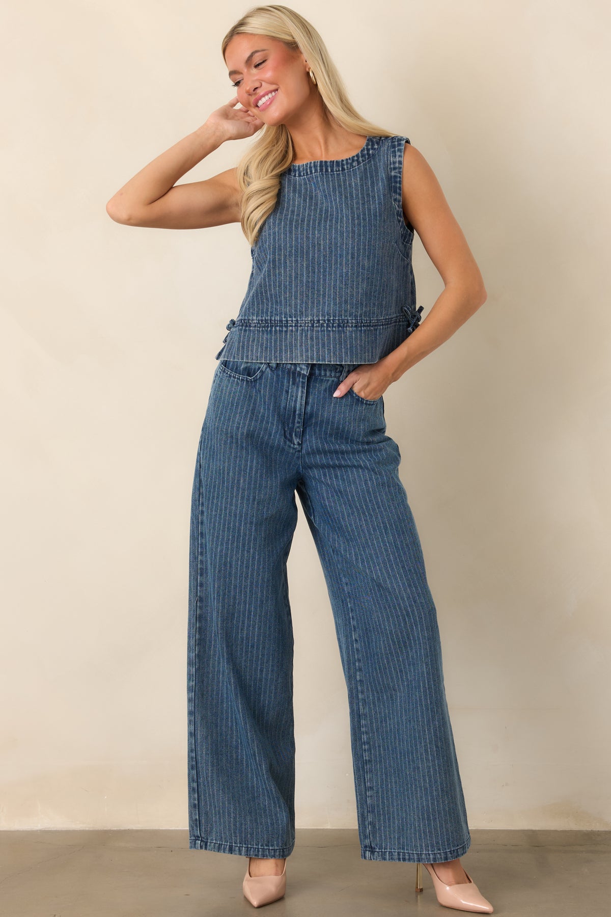 Wide-leg denim pants showcasing an indigo stripe pattern, comfortable elastic waist, functional drawstring, and relaxed fit through the legs.