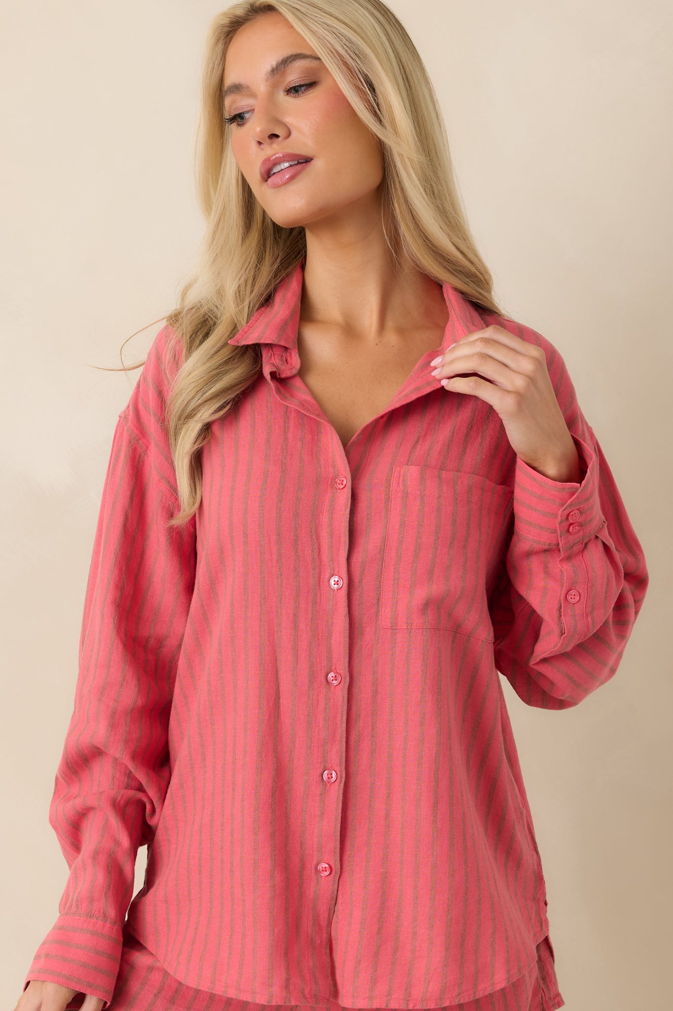 Close view of chest pocket and vertical stripe pattern on relaxed indigo top.