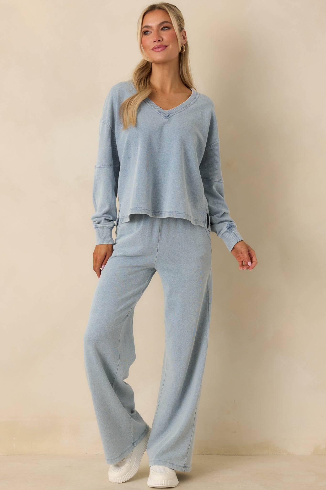 Indigo V-neck sweatshirt designed with long sleeves, a comfortable relaxed fit, and ribbed cuffs and hemline.