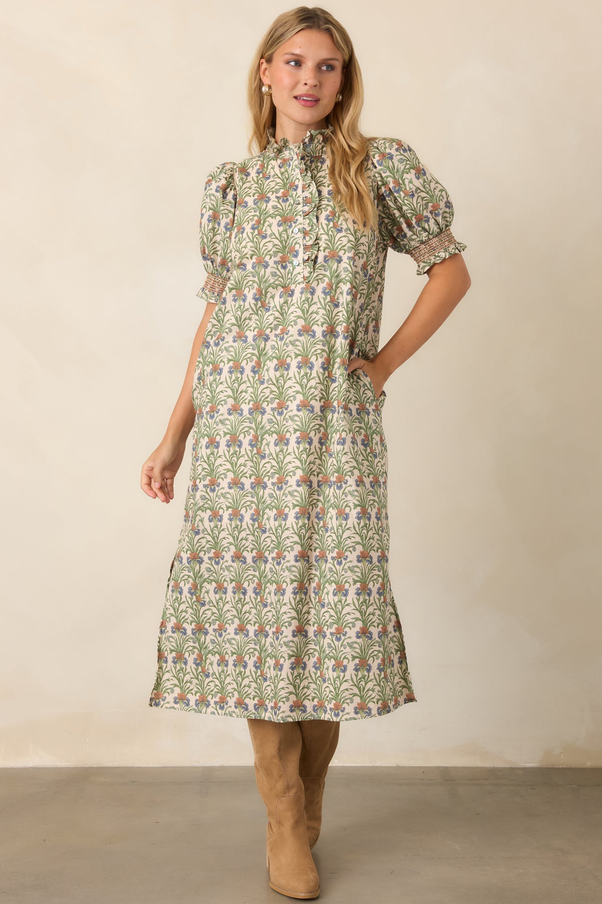 Relaxed ivory A-line dress with puff sleeves, smocked cuffs, and a partial ruffle-trimmed button front.