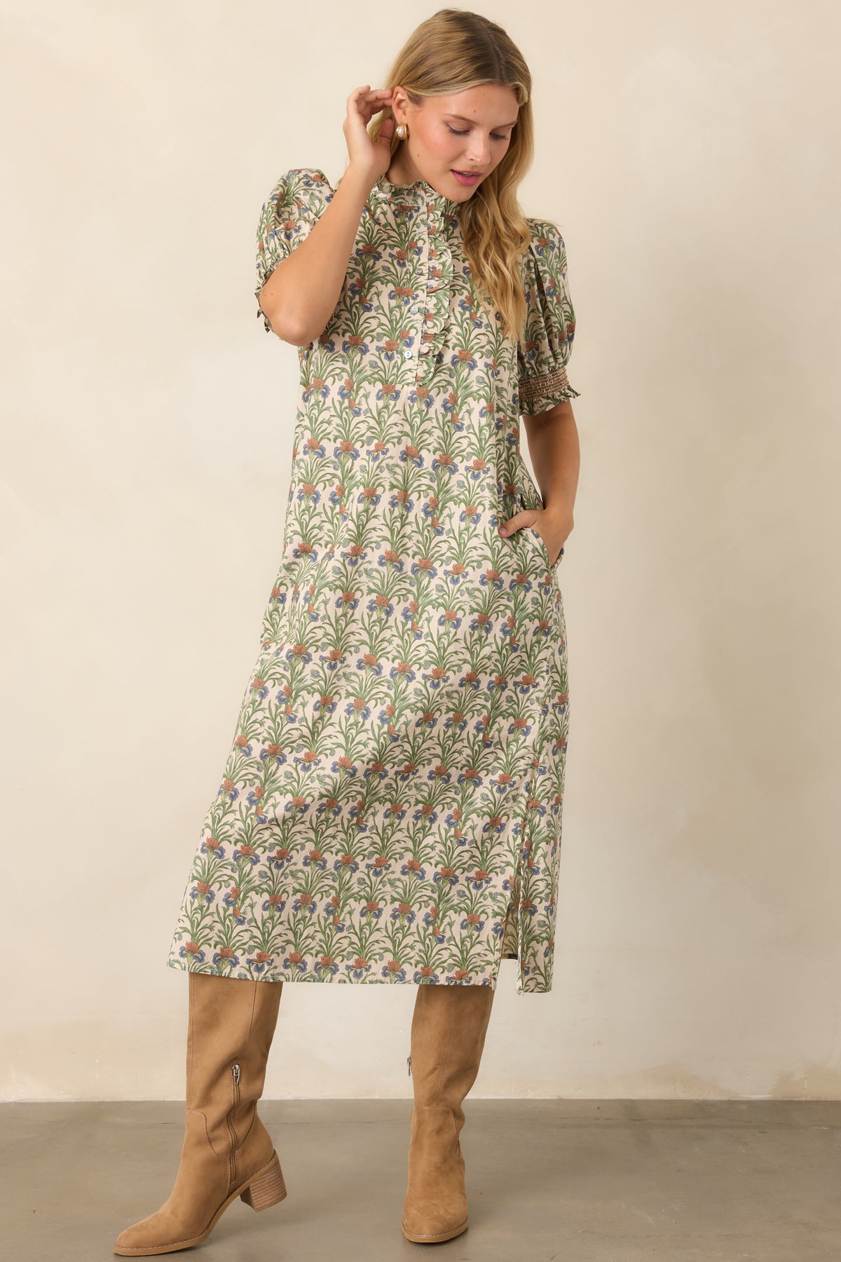 Ivory botanical cotton dress featuring softly gathered puff sleeves and a flowing A-line shape.