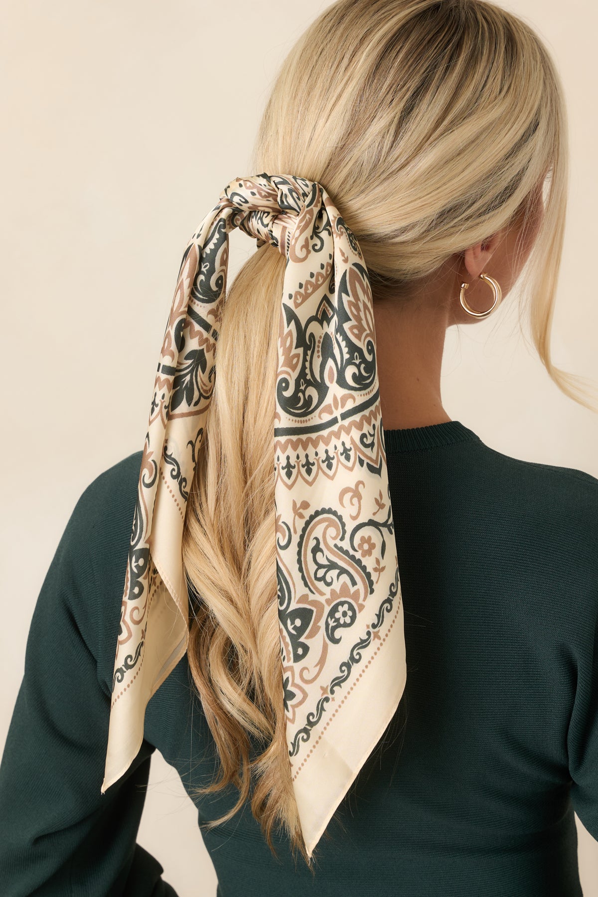 Square ivory hair scarf featuring intricate camel and deep olive paisley motifs, floral medallions, scrolling details, and an ornate border.
