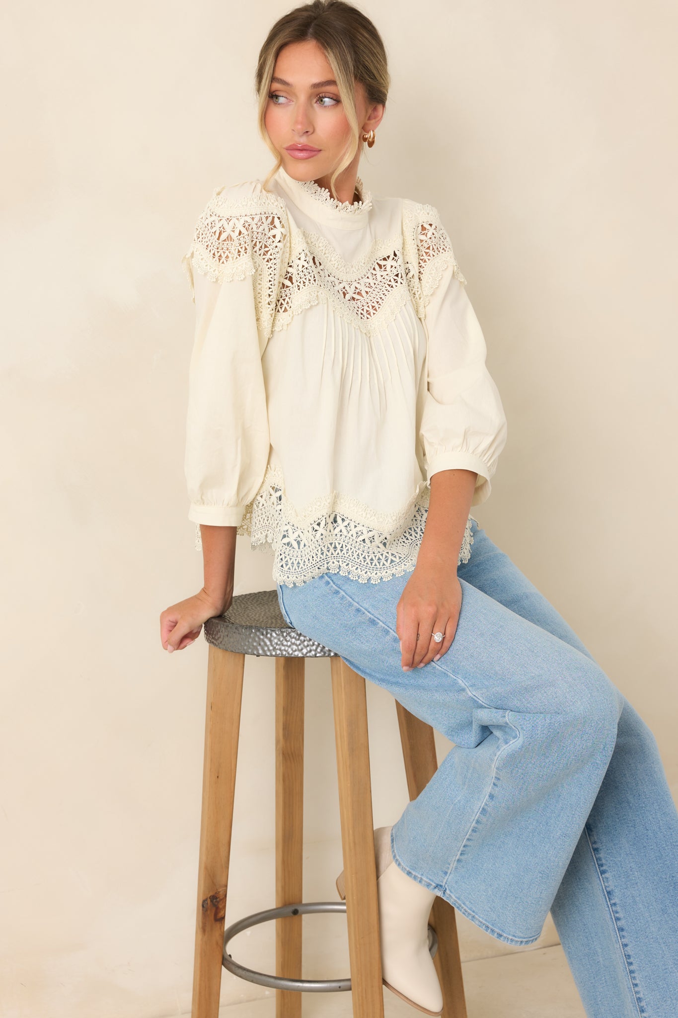 Ivory cotton blouse featuring a lace-trimmed high neckline, scalloped openwork yoke, and three-quarter balloon sleeves.