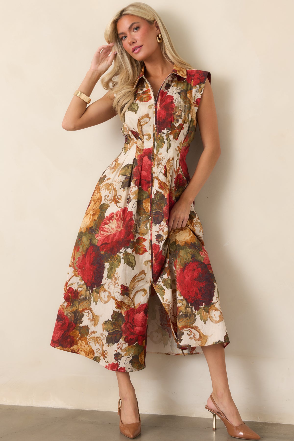 Ivory cotton dress featuring sweeping red, golden tan, and olive floral motifs.