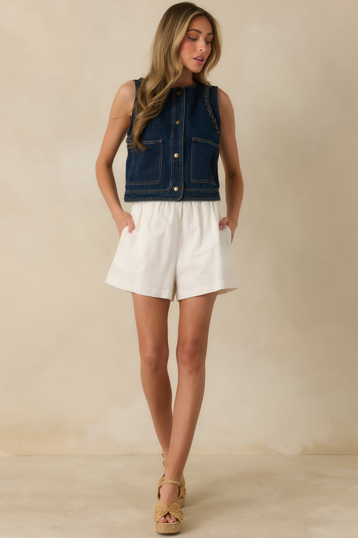 Full-length front view of ivory cotton-linen shorts with comfortable elastic waist and relaxed silhouette.