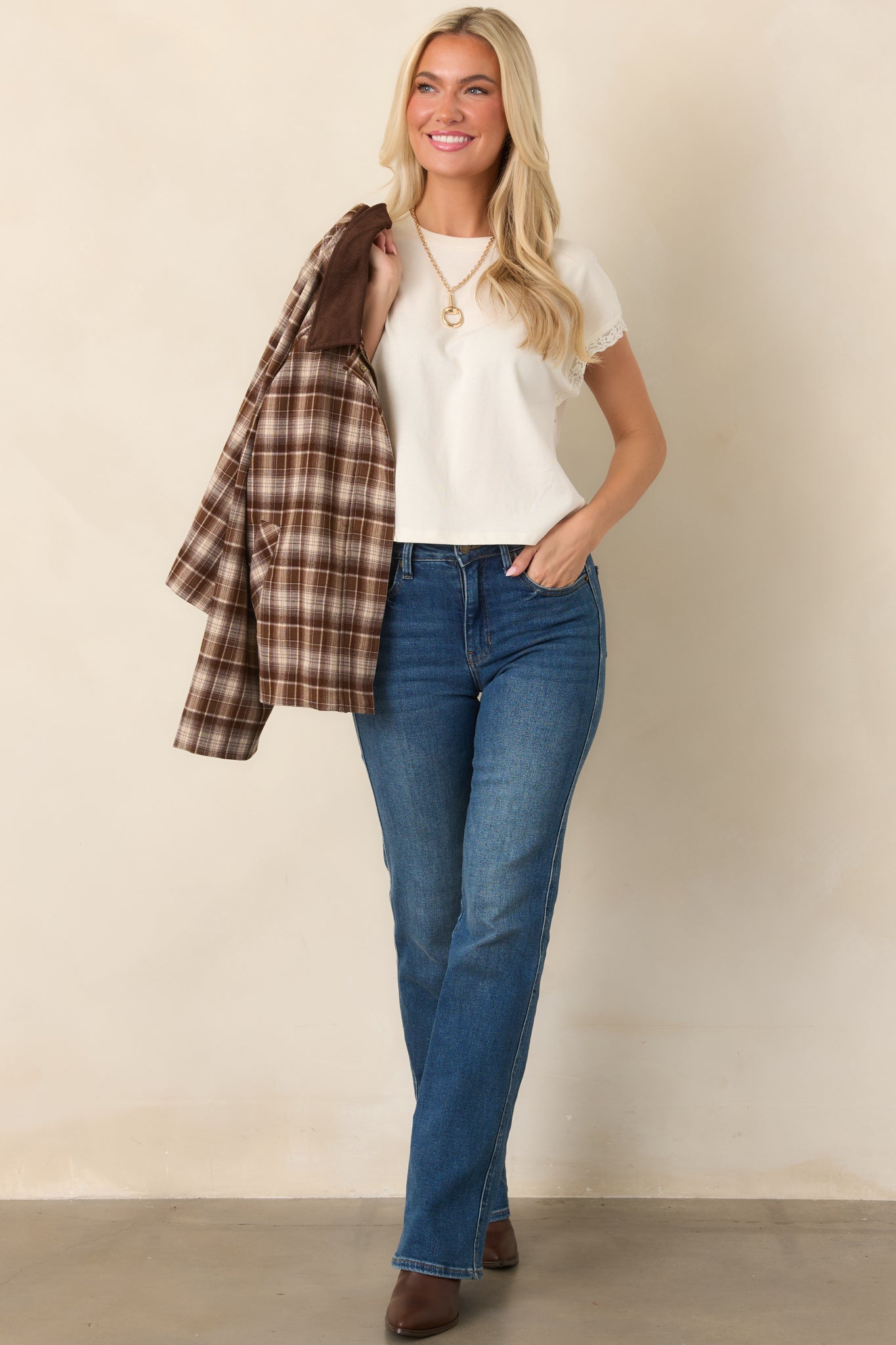 Ivory cotton-lyocell blend top with a crew neckline, cap-style muscle sleeves, delicate lace trim, relaxed fit, and slightly cropped length.
