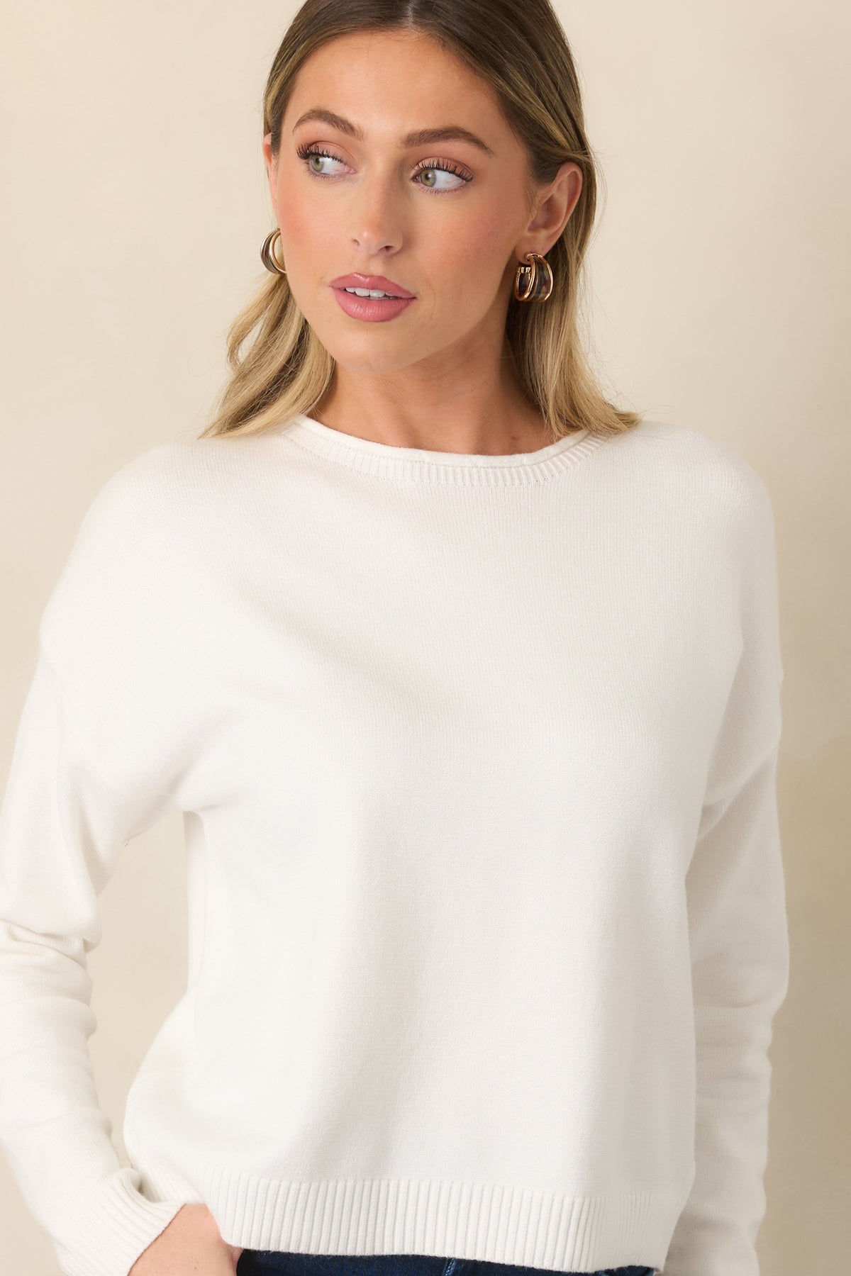 Ivory fine-knit texture gives this casual top a smooth, polished appearance.
