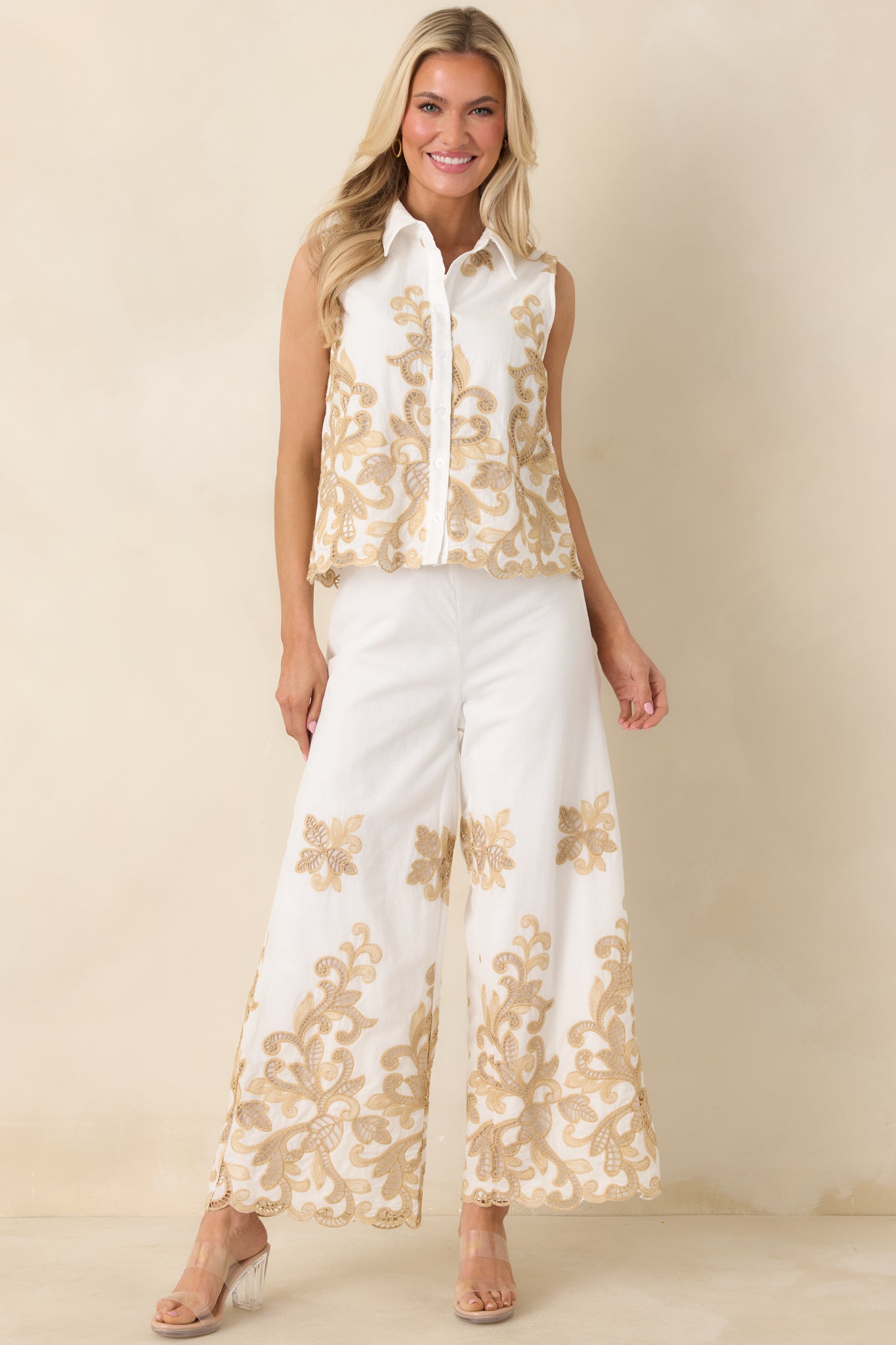 Ivory high-rise wide leg pants with breathable cotton fabric and elegant lace accents.