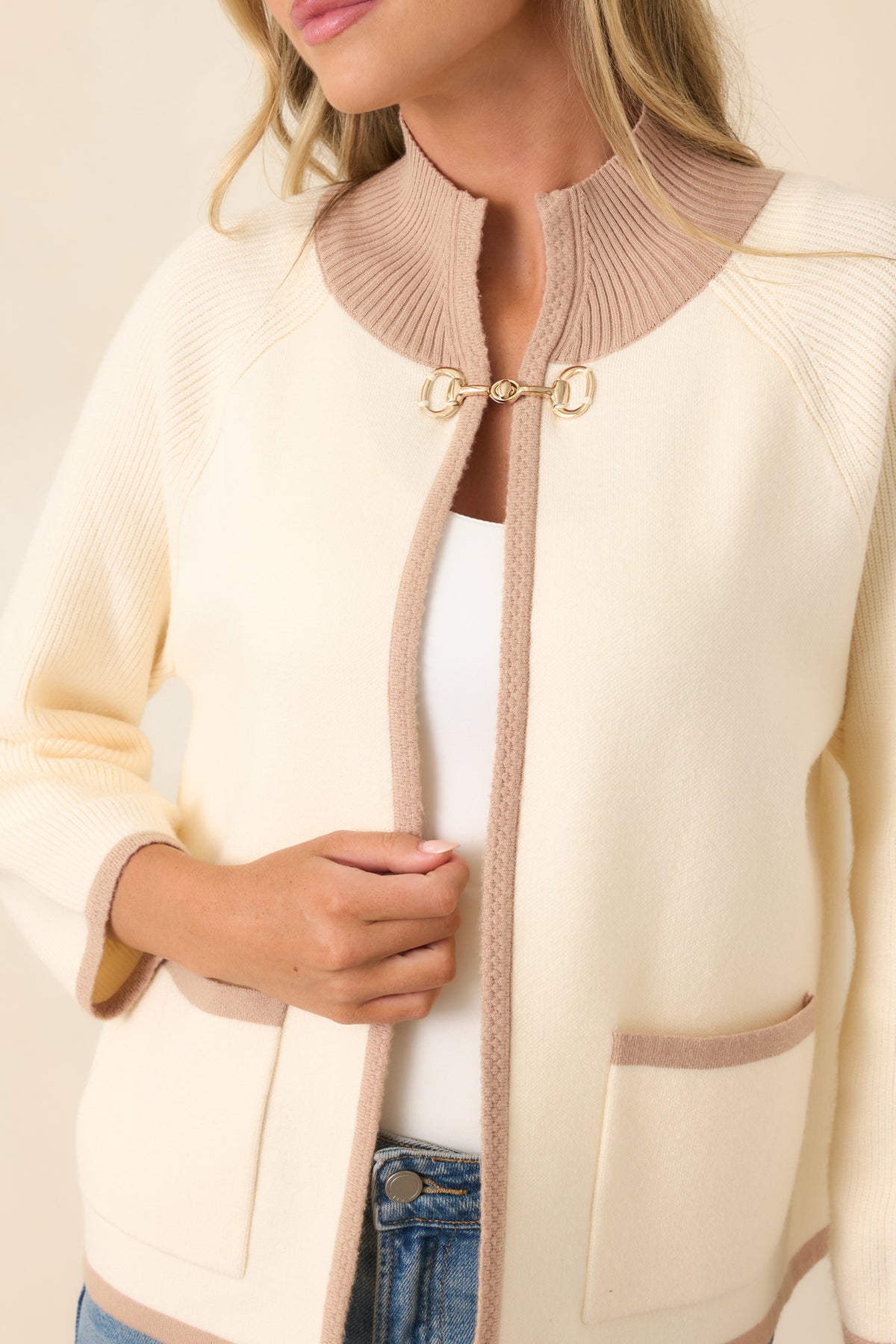 Close-up of the cardigan highlighting the soft viscose-blend knit, ribbed texture, taupe contrast trim, and polished horsebit hardware.