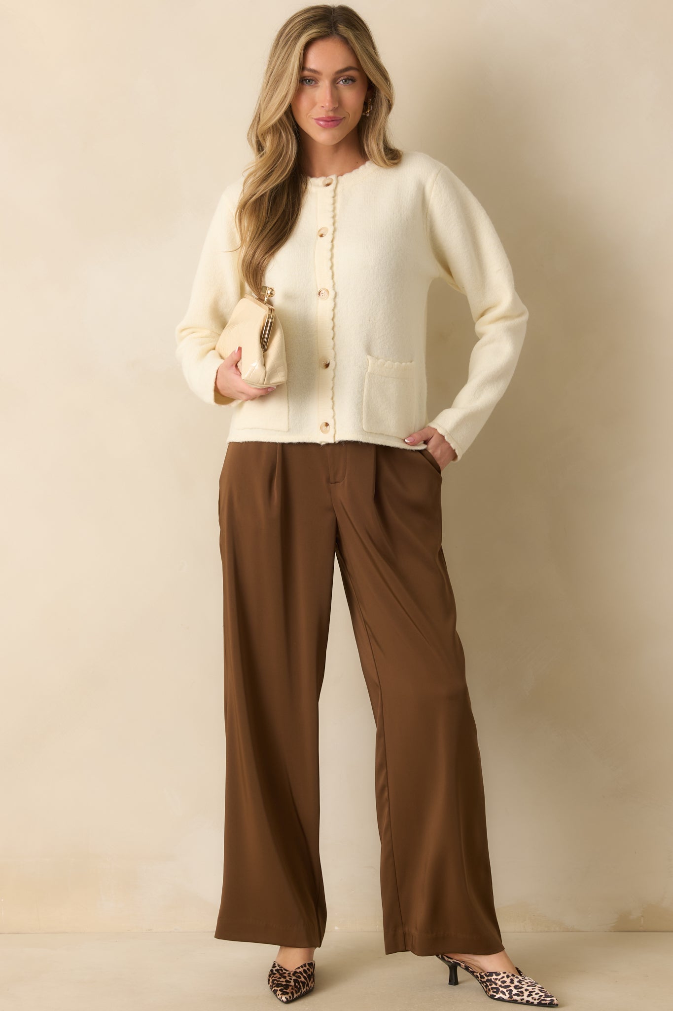 A full body view highlighting the functional front patch pockets and scalloped trim along the edges.