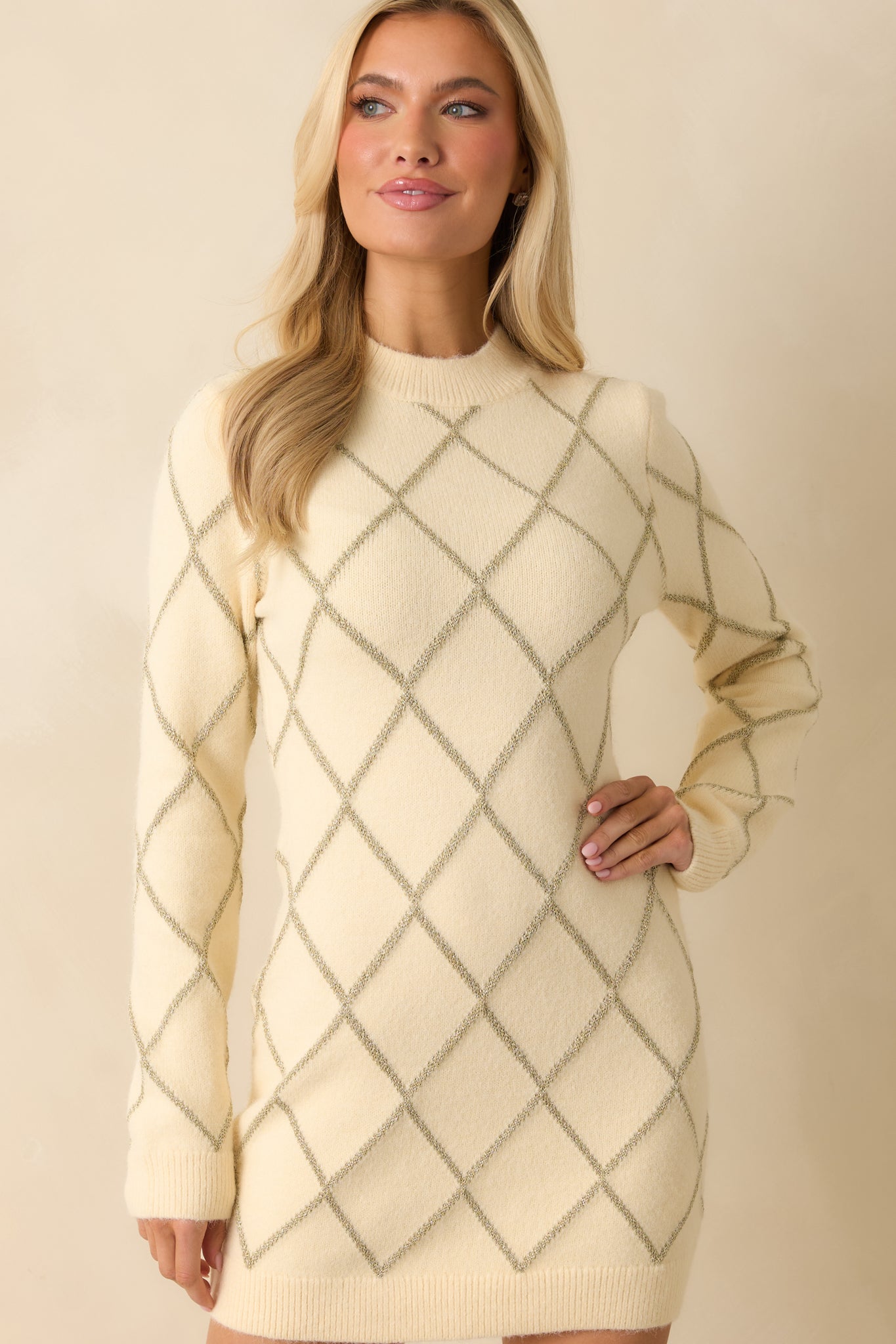 Soft ivory knit with sparkling argyle motifs and neatly finished ribbed trim.