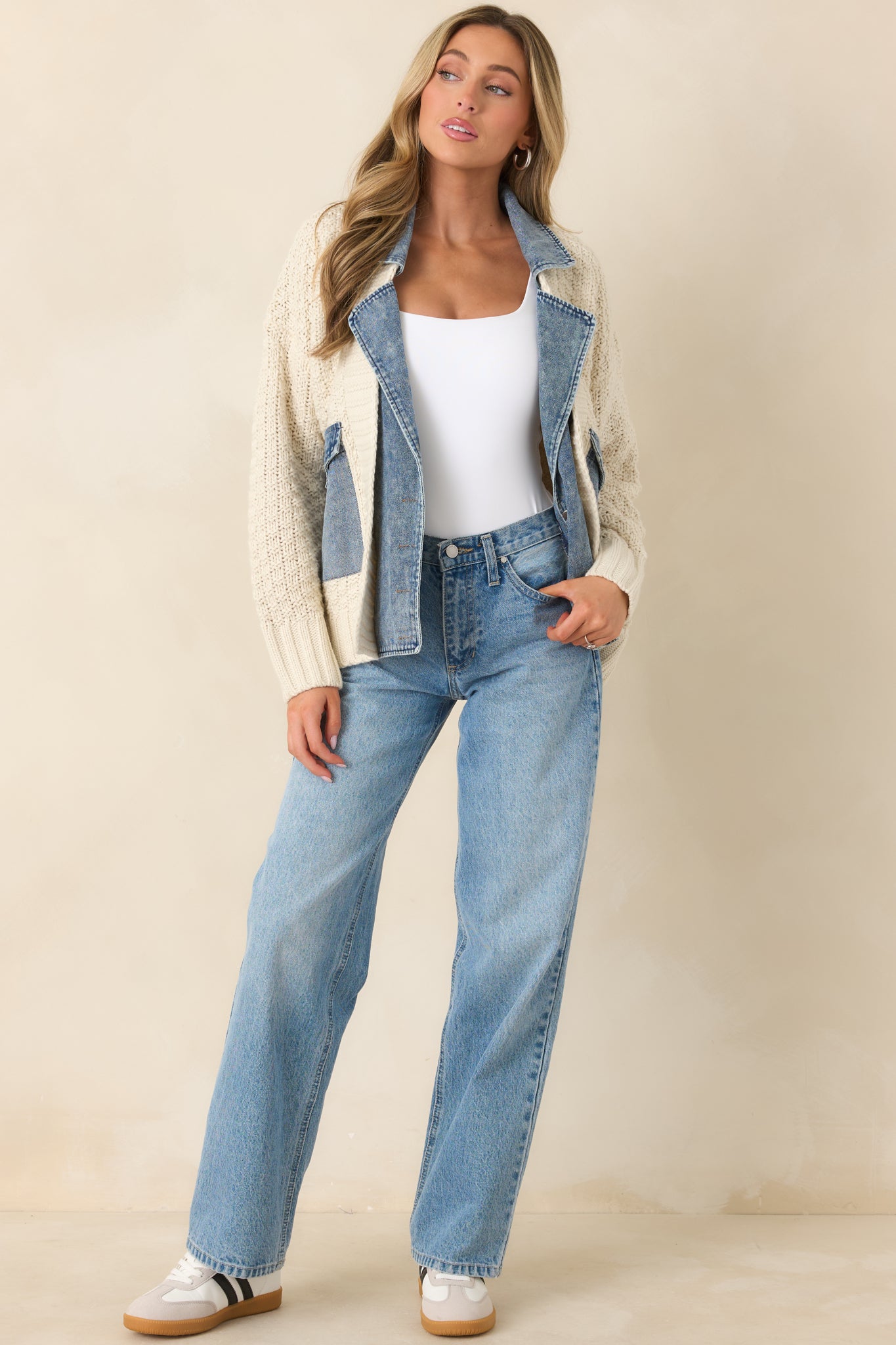 Ivory textured knit layer accented by denim trim along the collar, front placket, and pocket flaps.