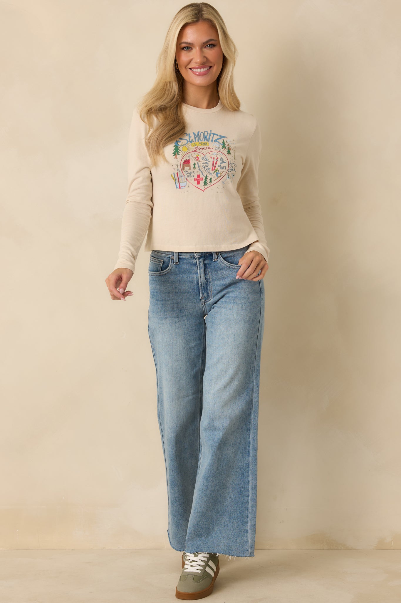 Ivory long sleeve top in lightweight cotton with clean crew neckline and casual fit.