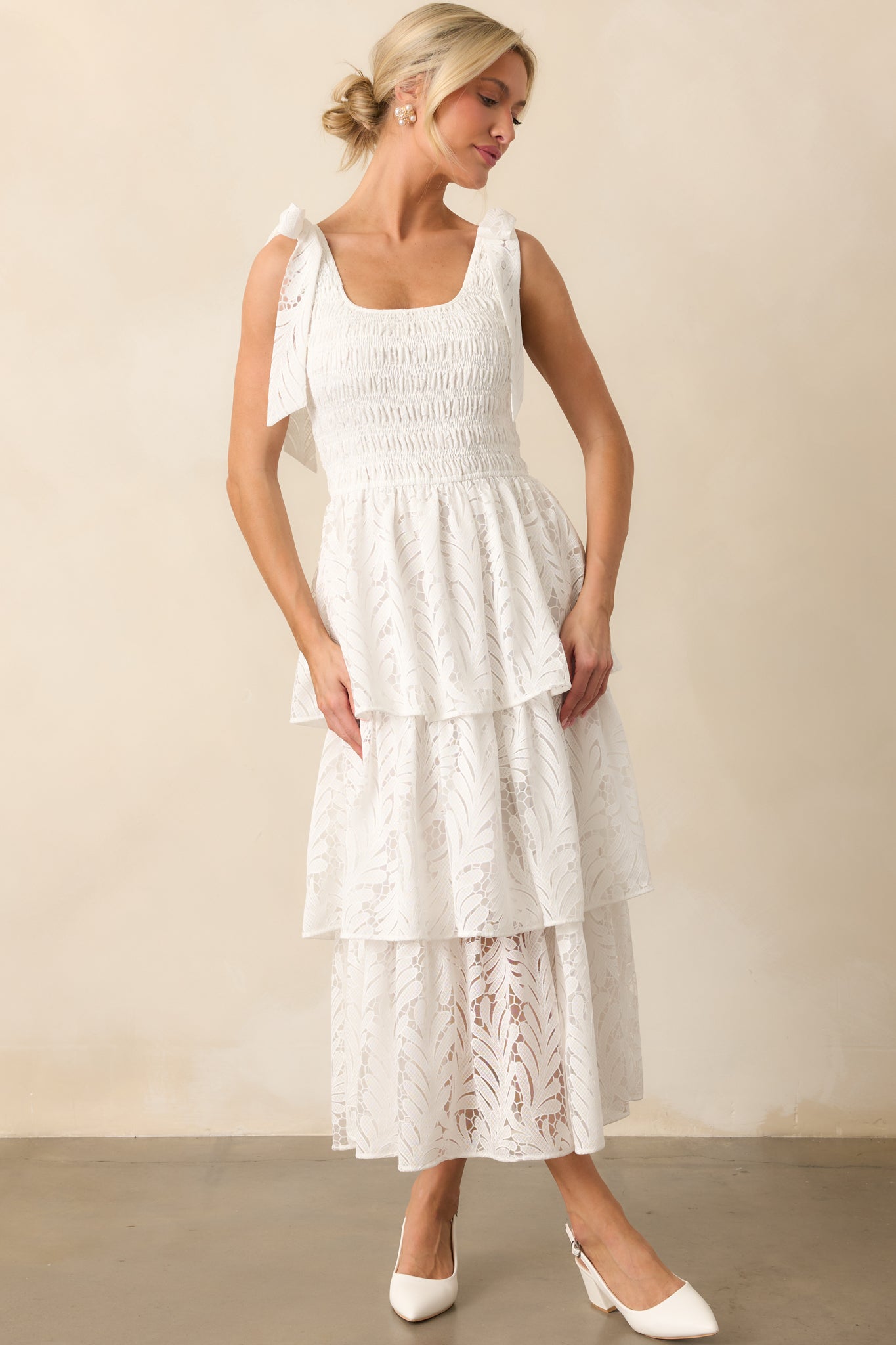Light and airy ivory maxi dress with a structured smocked bodice, lace-trimmed tiers, and a fully lined flowing skirt.