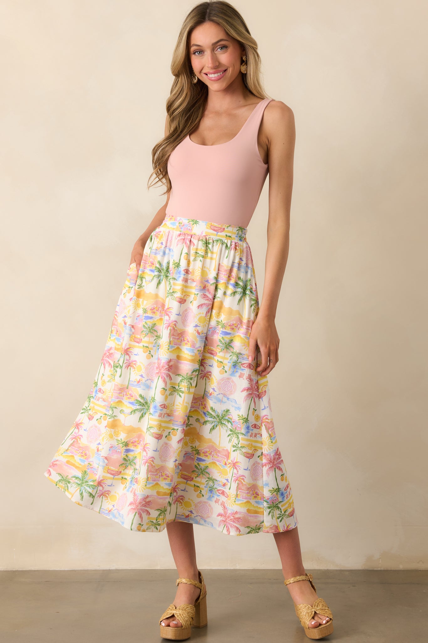 Full view of an ivory maxi skirt with a vibrant multicolor tropical print and a flowing silhouette.