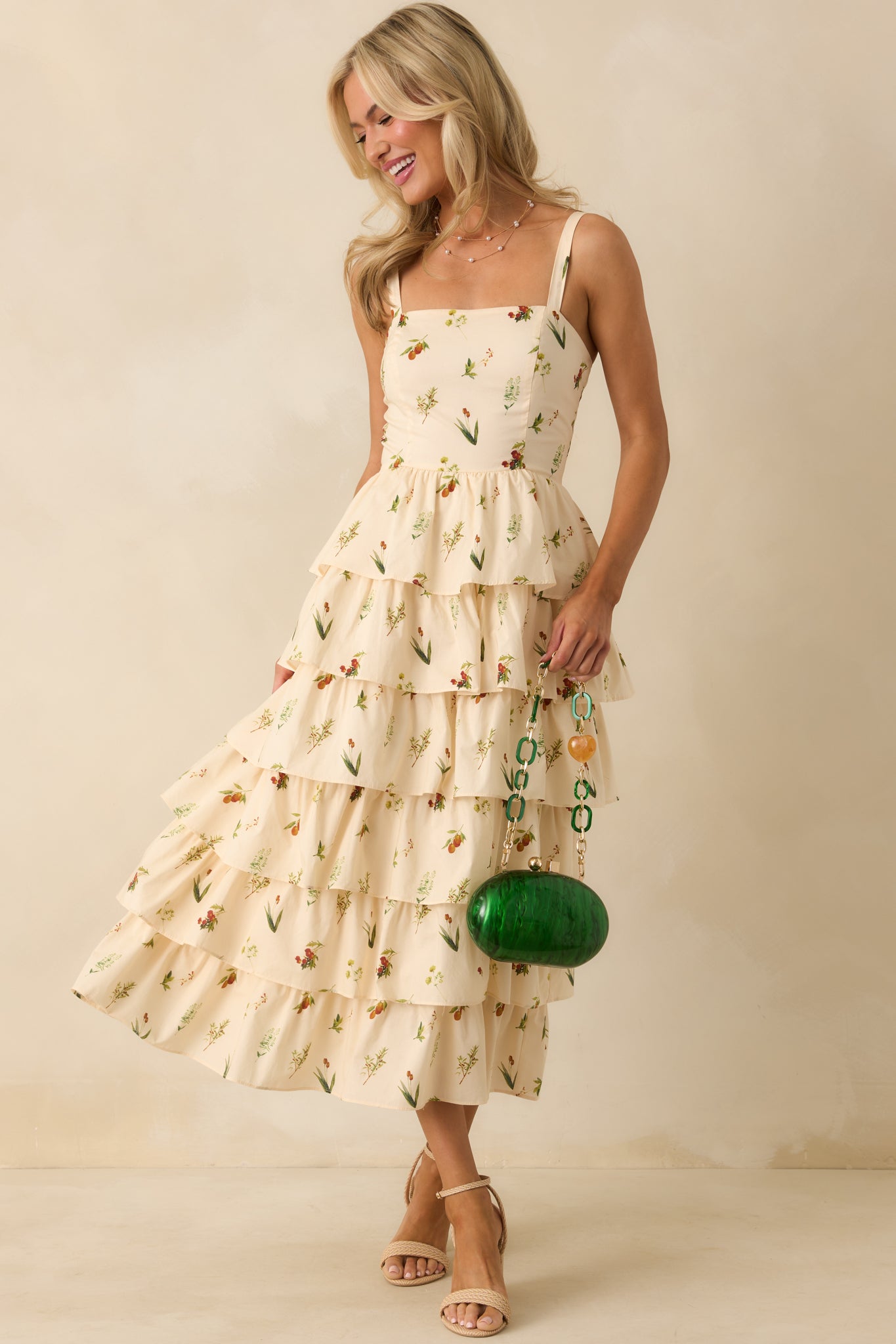 Ivory midi dress with multicolor floral print, square neckline, and tiered skirt.
