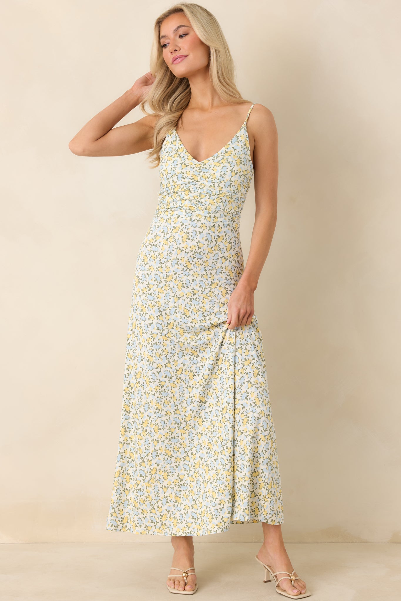 Ivory multi maxi dress highlighting a relaxed, flowy skirt, adjustable spaghetti straps, and lightweight woven construction.