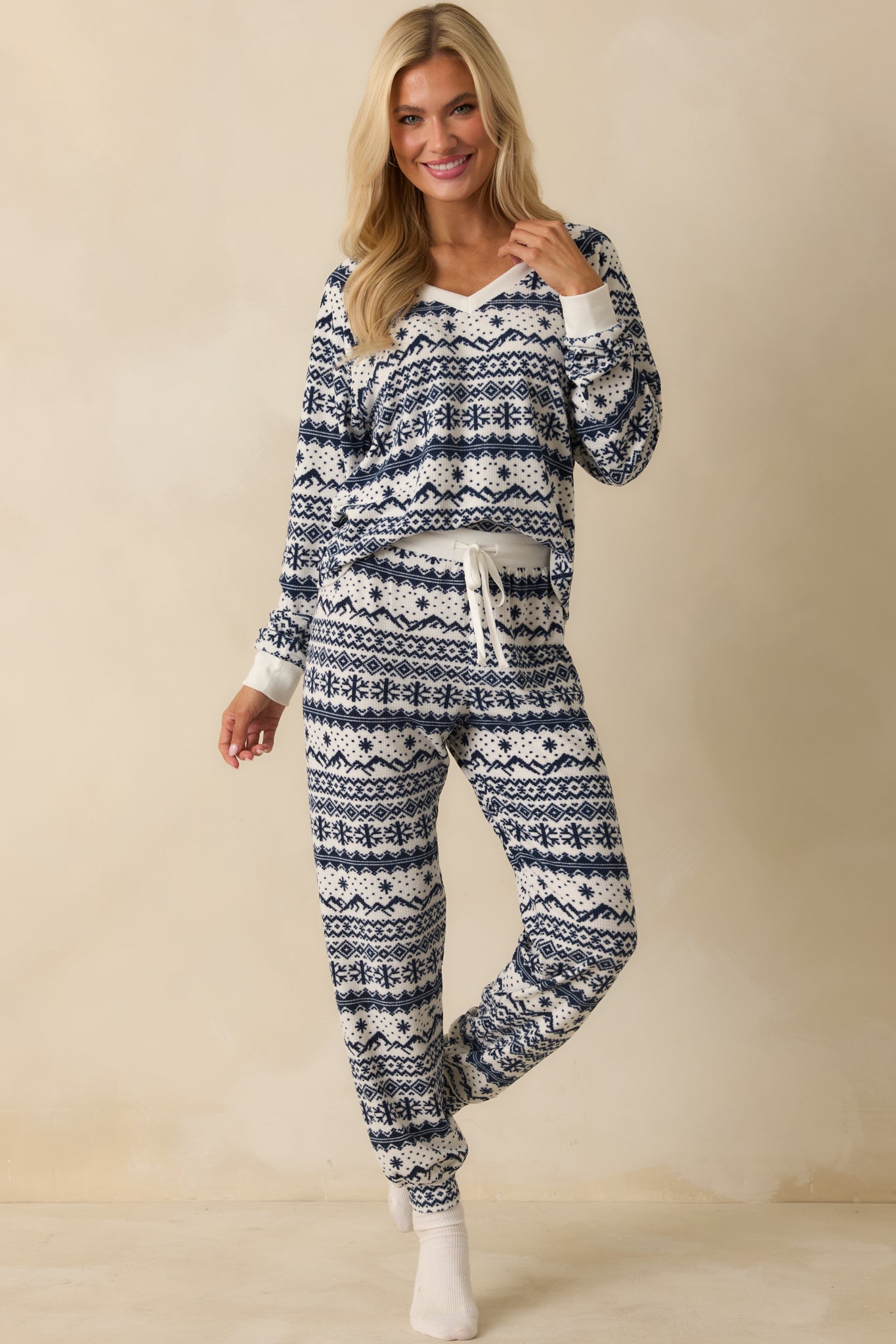 Fair Isle patterned top in plush ivory and navy velour with a comfortable, relaxed silhouette and V-neck detail.