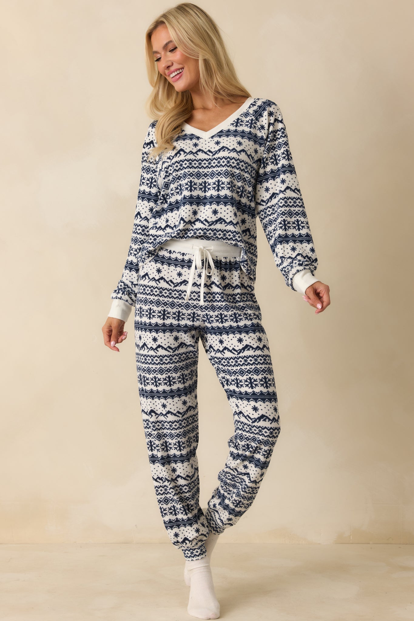 Ivory and navy Fair Isle top featuring a velvety waffle knit texture, V-neckline, and relaxed fit for an easy, cozy look.