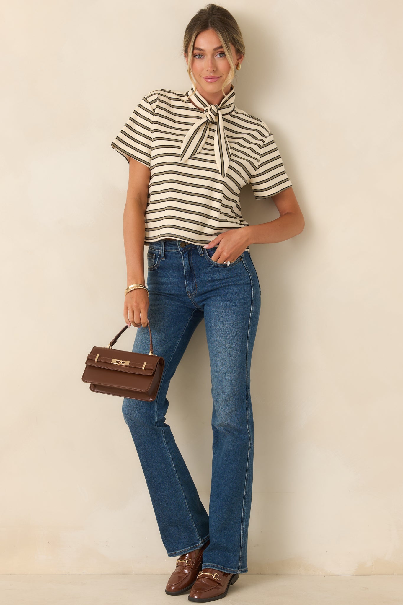Ivory short sleeve tee featuring slim olive horizontal stripes, a relaxed silhouette, and soft cotton-blend construction with stretch.