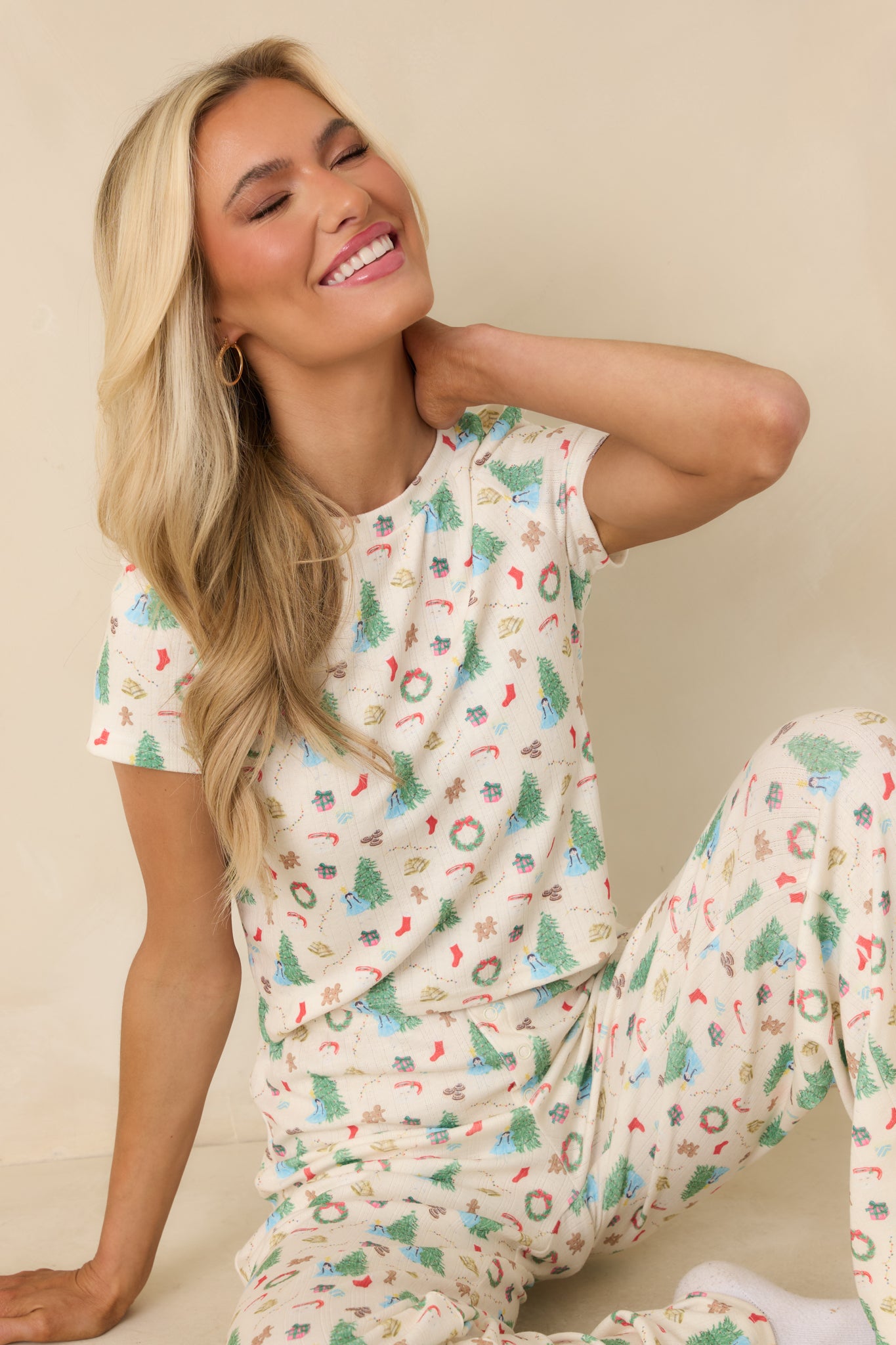 Ivory pajama top with an allover Christmas tree–inspired print, relaxed fit, and soft lightweight knit for comfortable lounging.