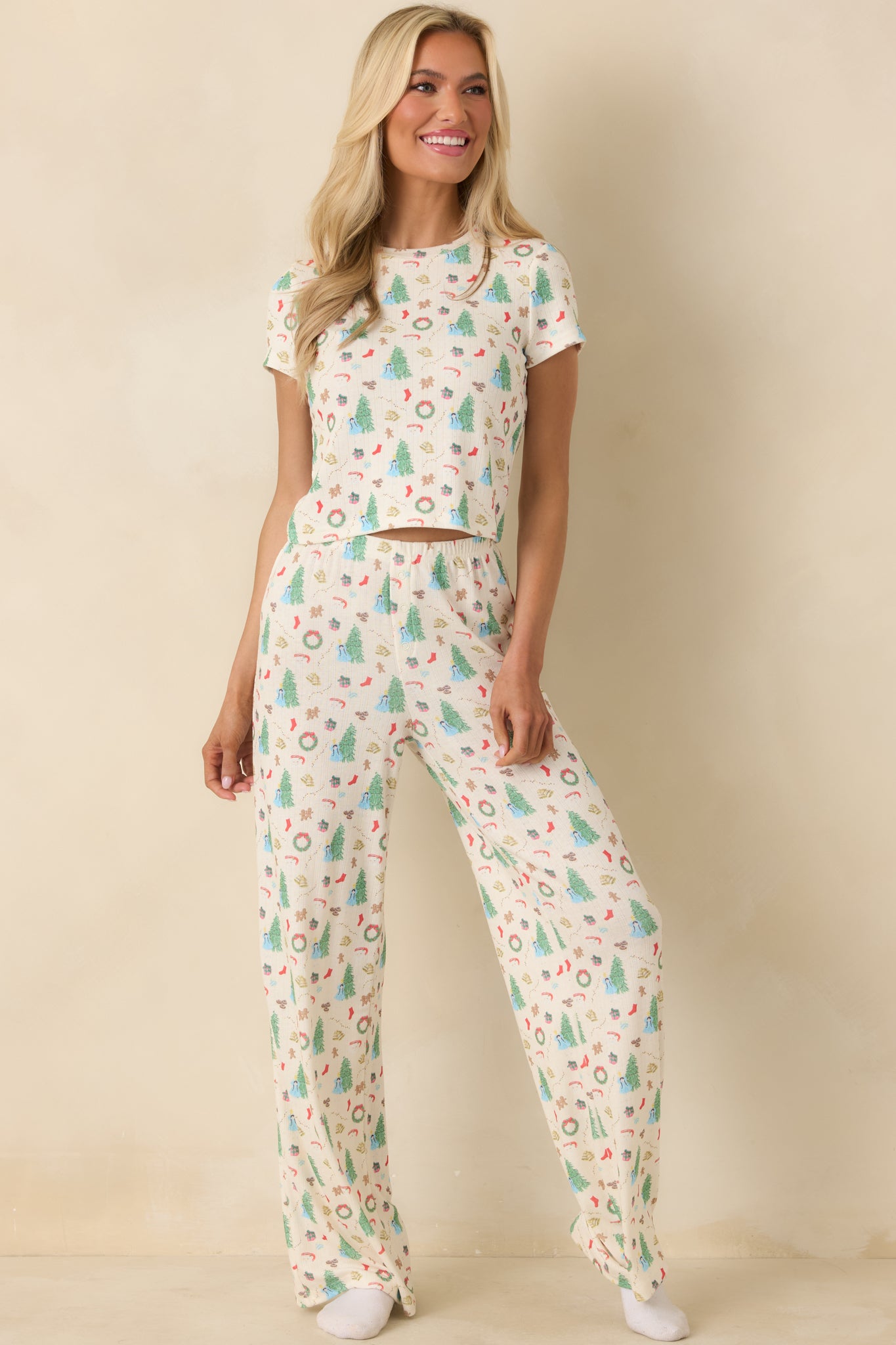 Ivory pajama top with an allover Christmas tree–inspired print, relaxed fit, and soft lightweight knit for comfortable lounging.