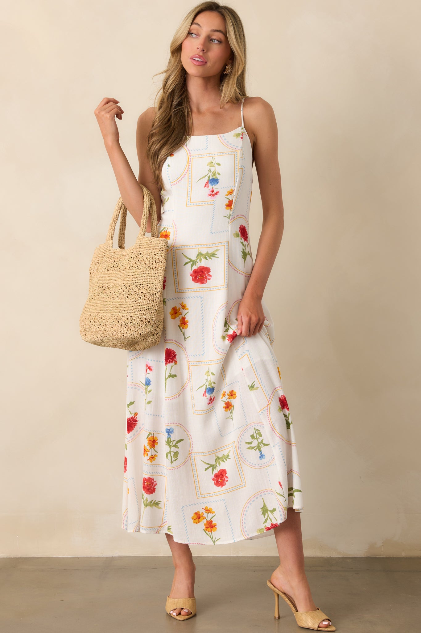 A front view of the ivory patchwork dress with adjustable straps and a sleeveless design, featuring a relaxed, flowing silhouette.