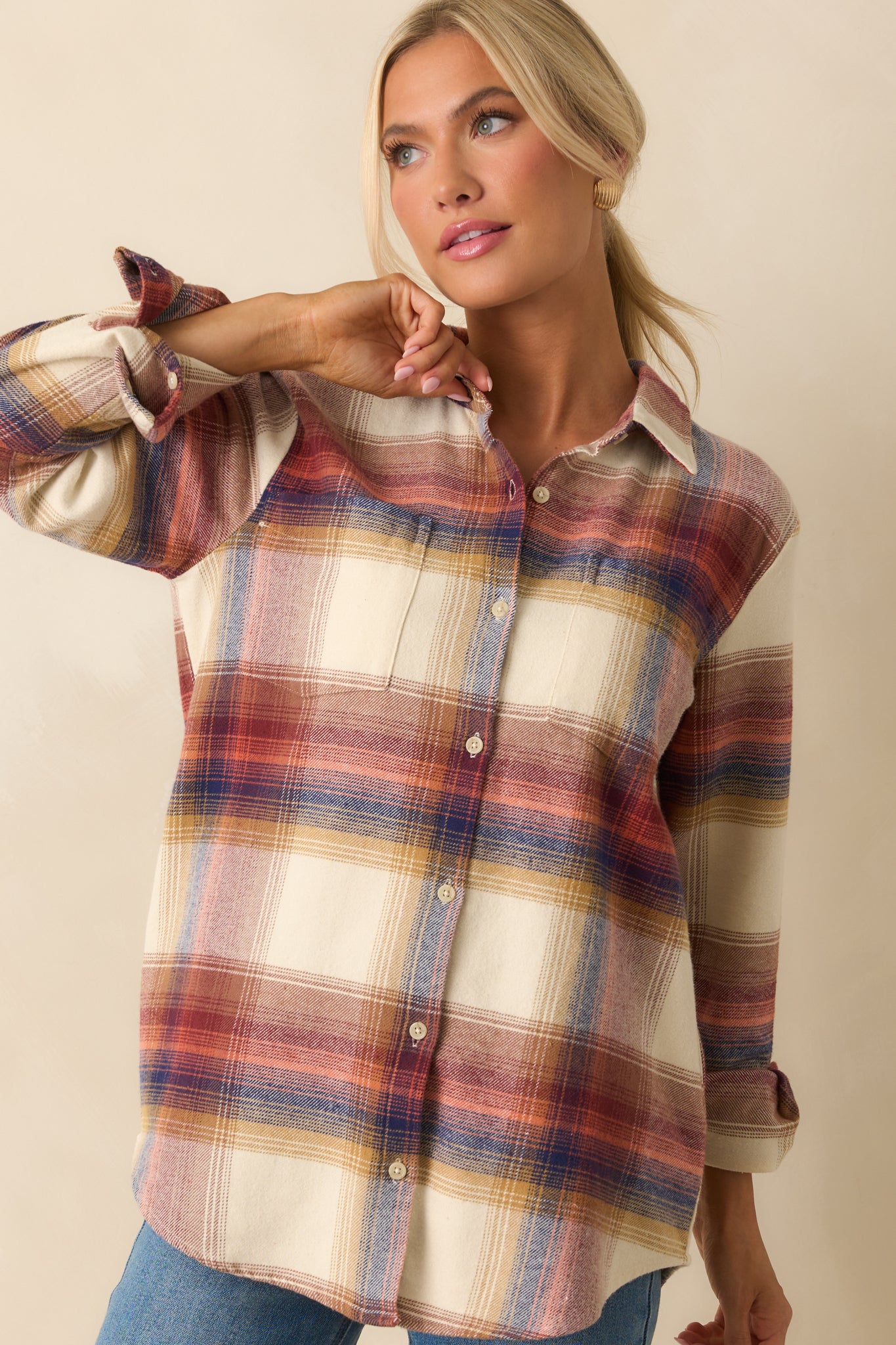 Ivory plaid flannel shirt with collared neckline, button front closure, long sleeves with button cuffs, and a scoop bottom hem, front view.