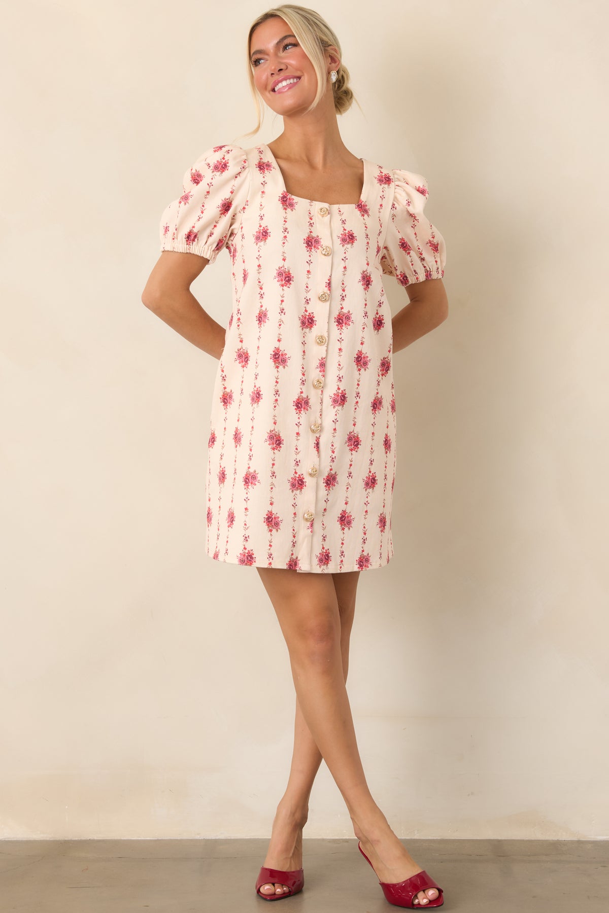 Structured cotton-blend mini dress showcasing an elongated rose-and-vine print, feminine square neckline, and softly puffed sleeves.
