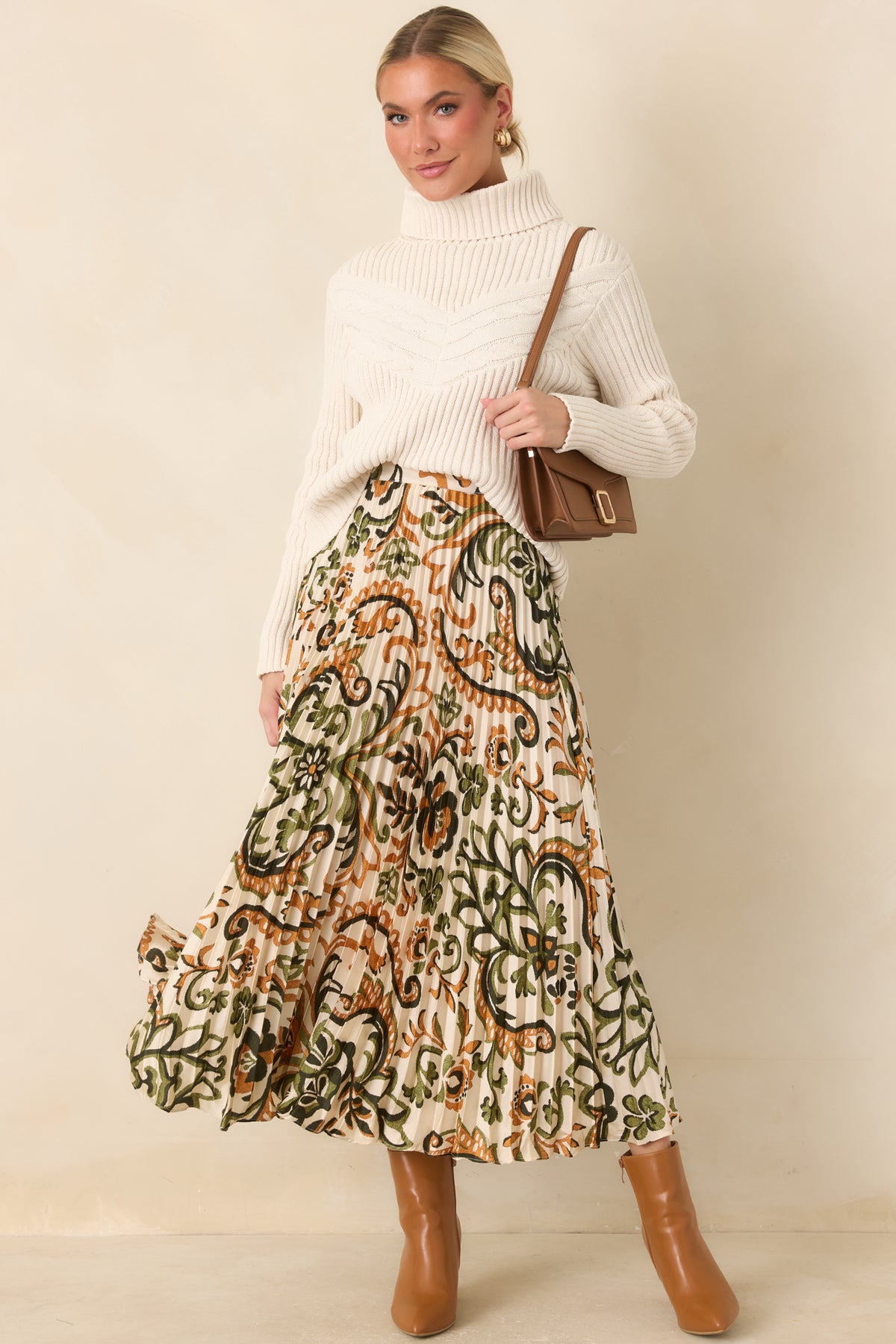 Ivory satin maxi skirt with olive, deep green, and camel floral paisley motifs and fine accordion pleats.