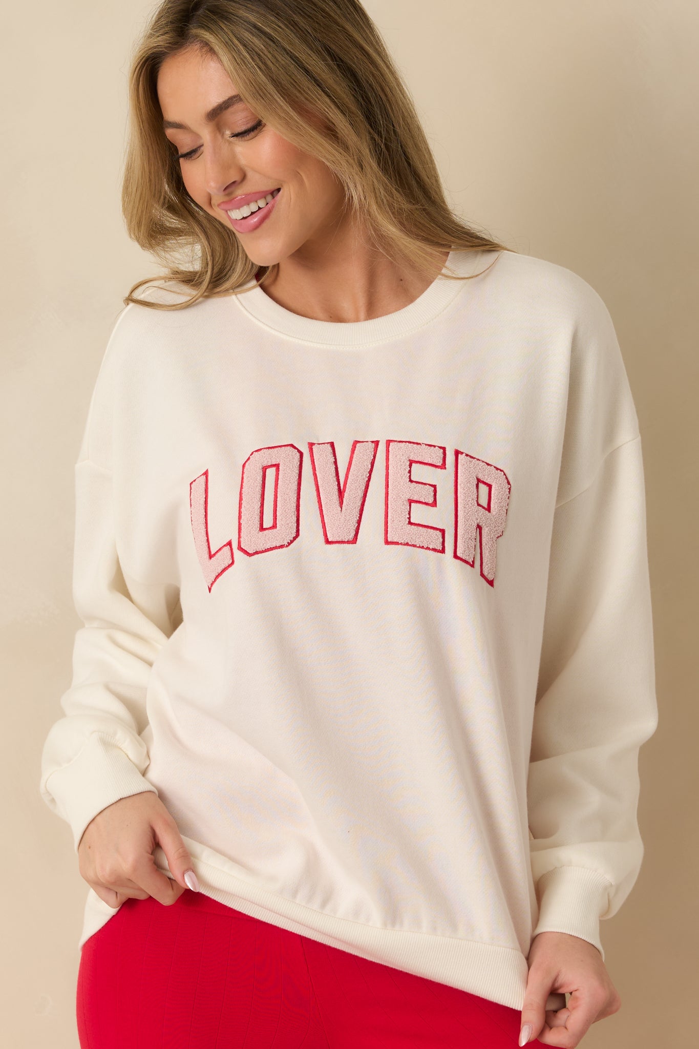 Ivory sweatshirt showcasing the relaxed fit and clean crew neckline