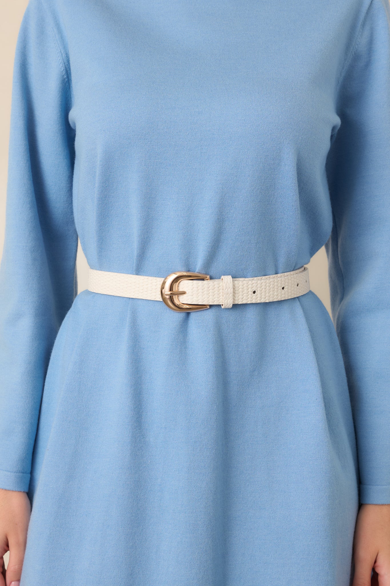 Textured ivory belt showcasing its dimensional woven finish, classic gold-tone buckle, and customizable sizing.
