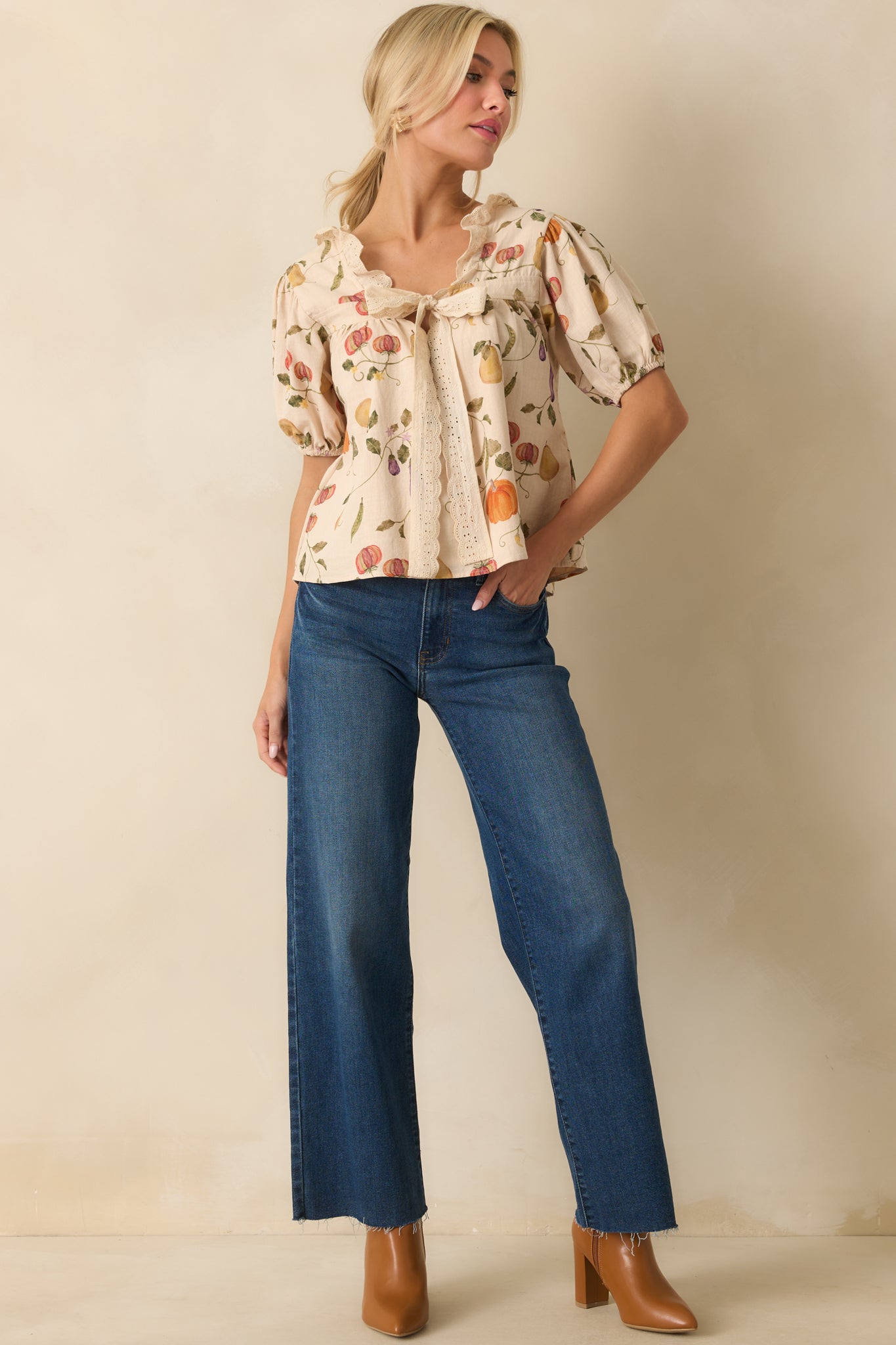 Ivory top with multicolored vegetable print, ruffled neckline, and cropped relaxed fit shown in full front view.