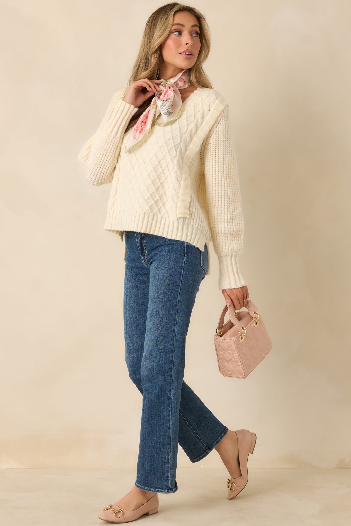 Ivory V-neck knit sweater with evenly textured panels and a soft, lightweight knit for layering comfort.