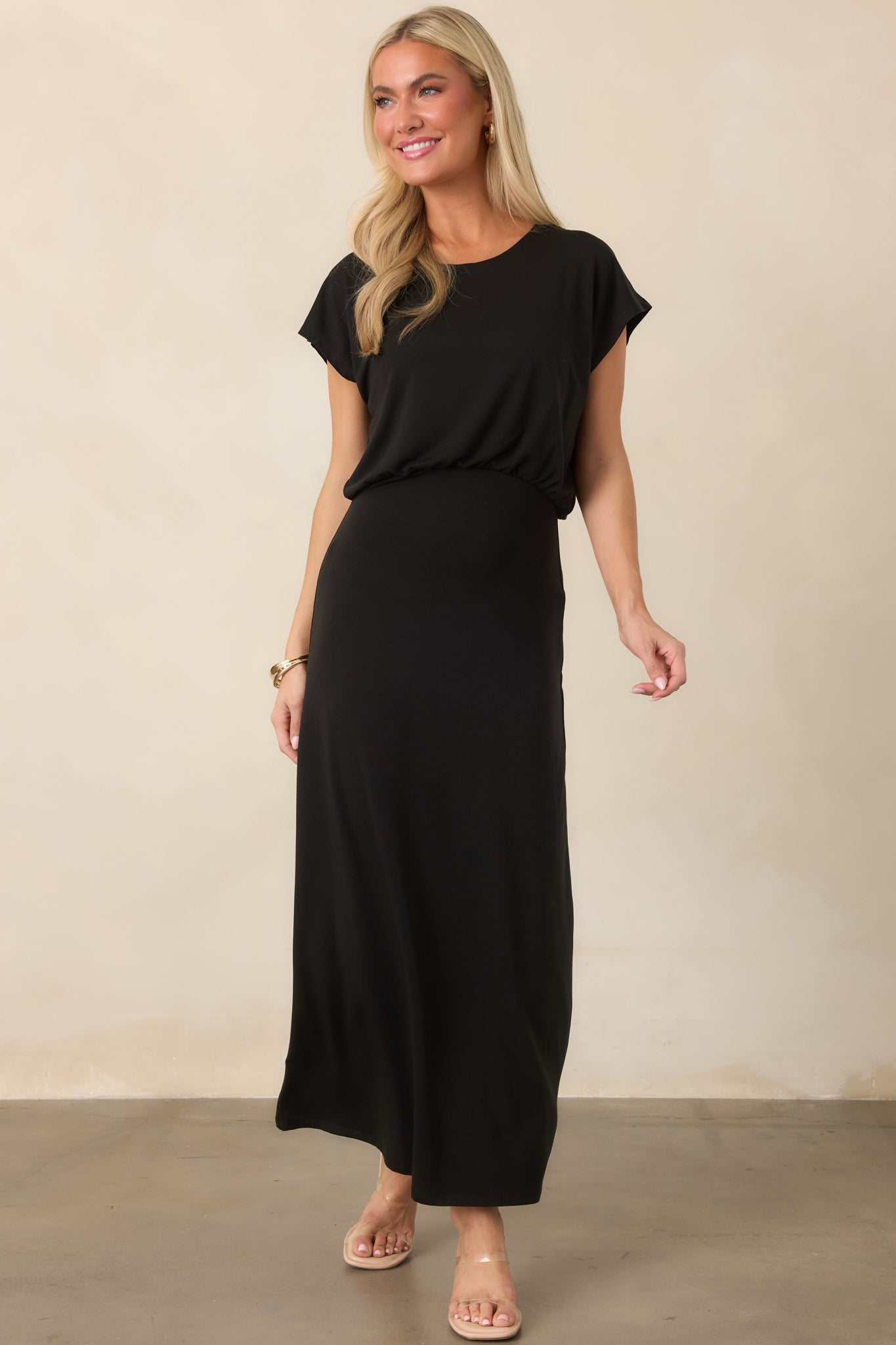 Polished jersey dress with short sleeves, a softly gathered waist, fluid blouson top, and streamlined midi skirt.