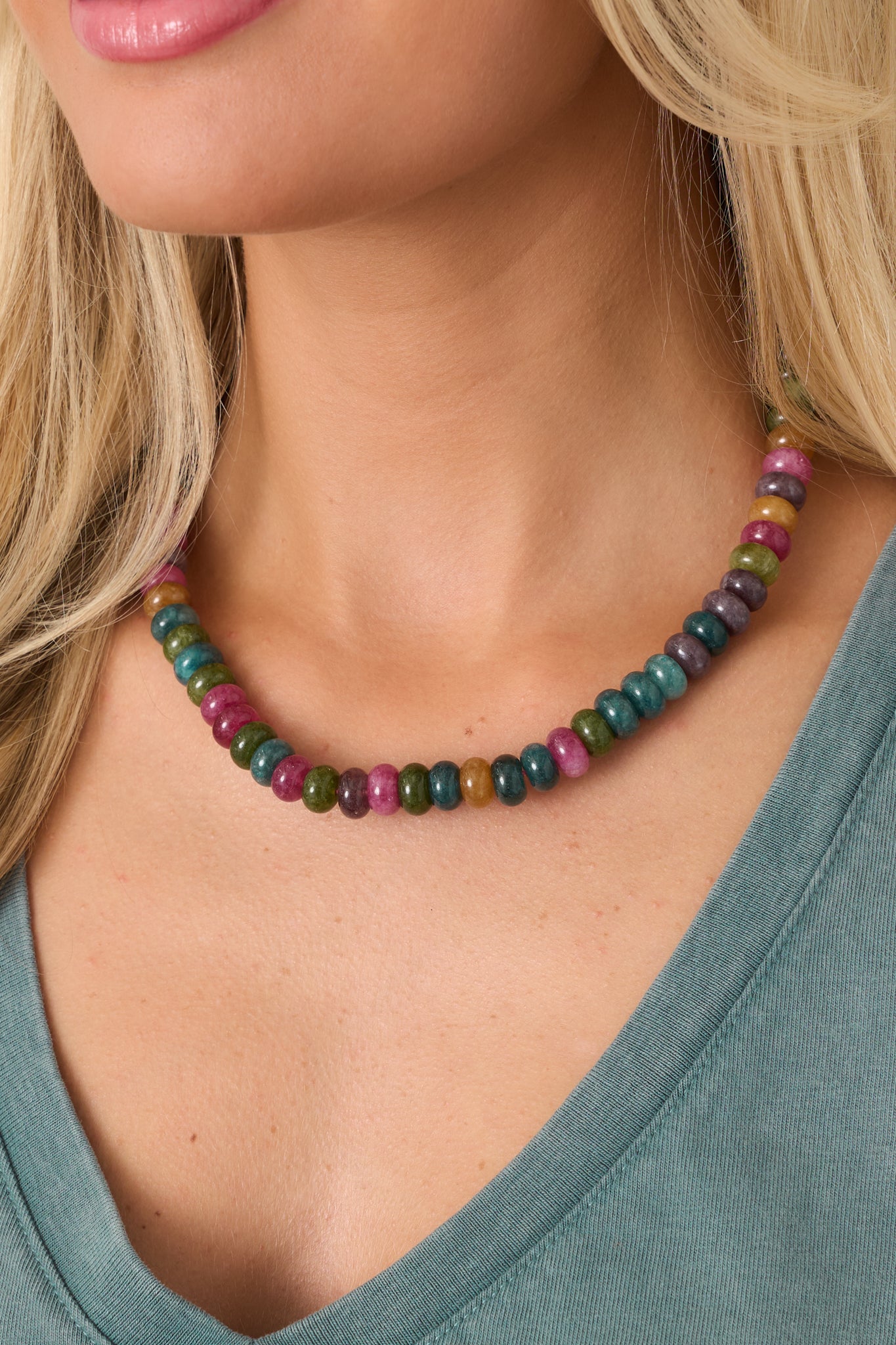 Colorful disc bead necklace showcasing a rich mix of jewel-toned beads in varied shades for a layered, dimensional look.