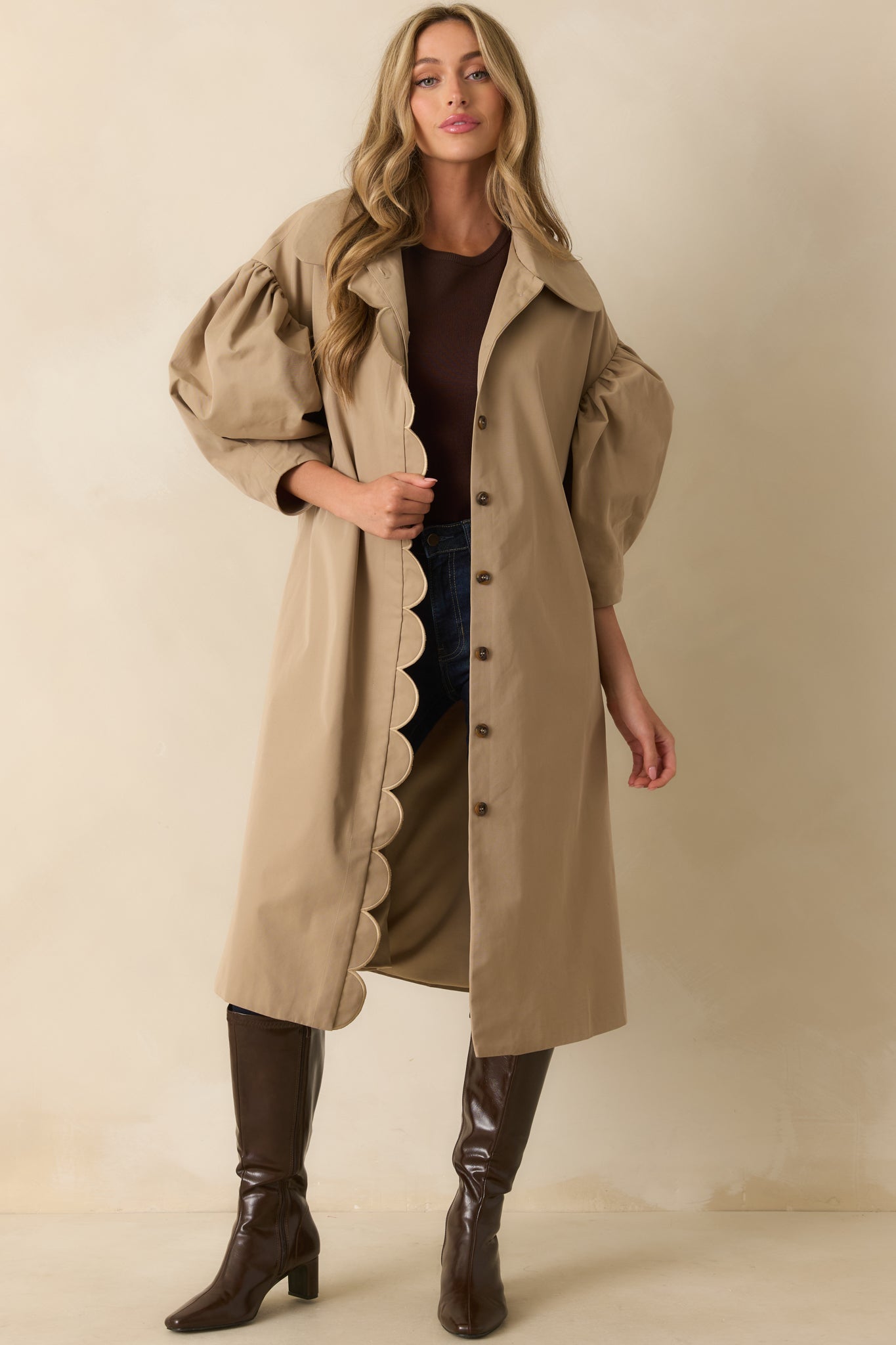 Relaxed fit khaki coat with structured puff sleeves and clean tailoring.