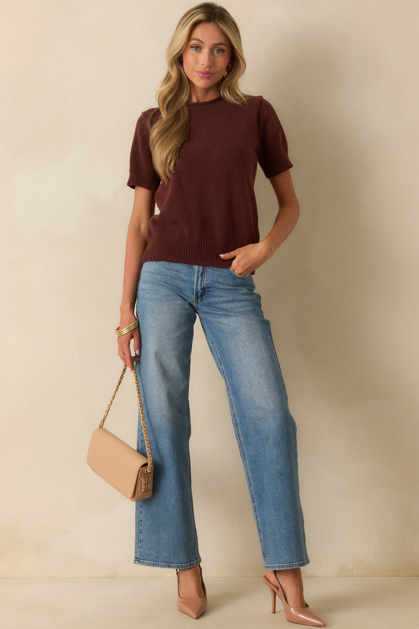 Knit brown top with smooth texture and casual relaxed fit.