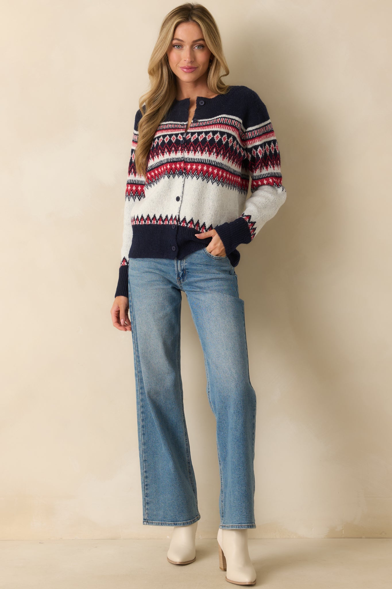 Front view of midweight knit cardigan featuring crew neckline, ribbed cuffs and hem, and colorful patterned design.