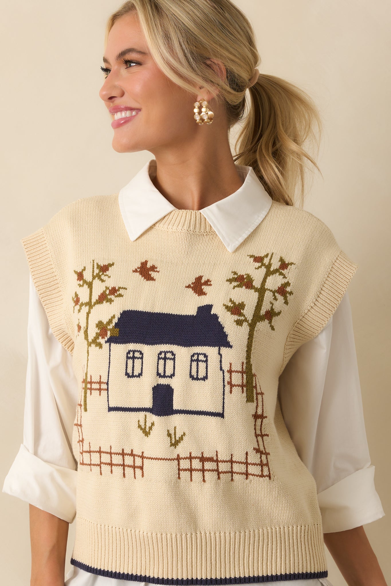 Close-up of the intarsia house and tree motif on the front of the vest.