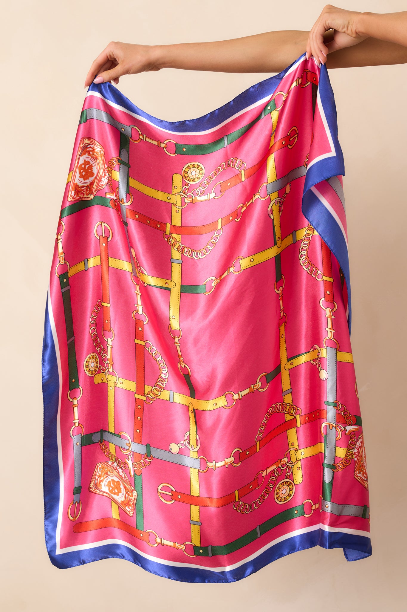 Laid-out view of the multi-color print scarf highlighting the glossy satin material and intricate pattern details.